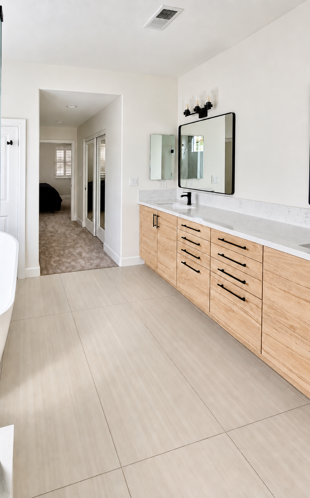 Long wood vanity with a white countertop, bathroom remodel in San Carlos, CA