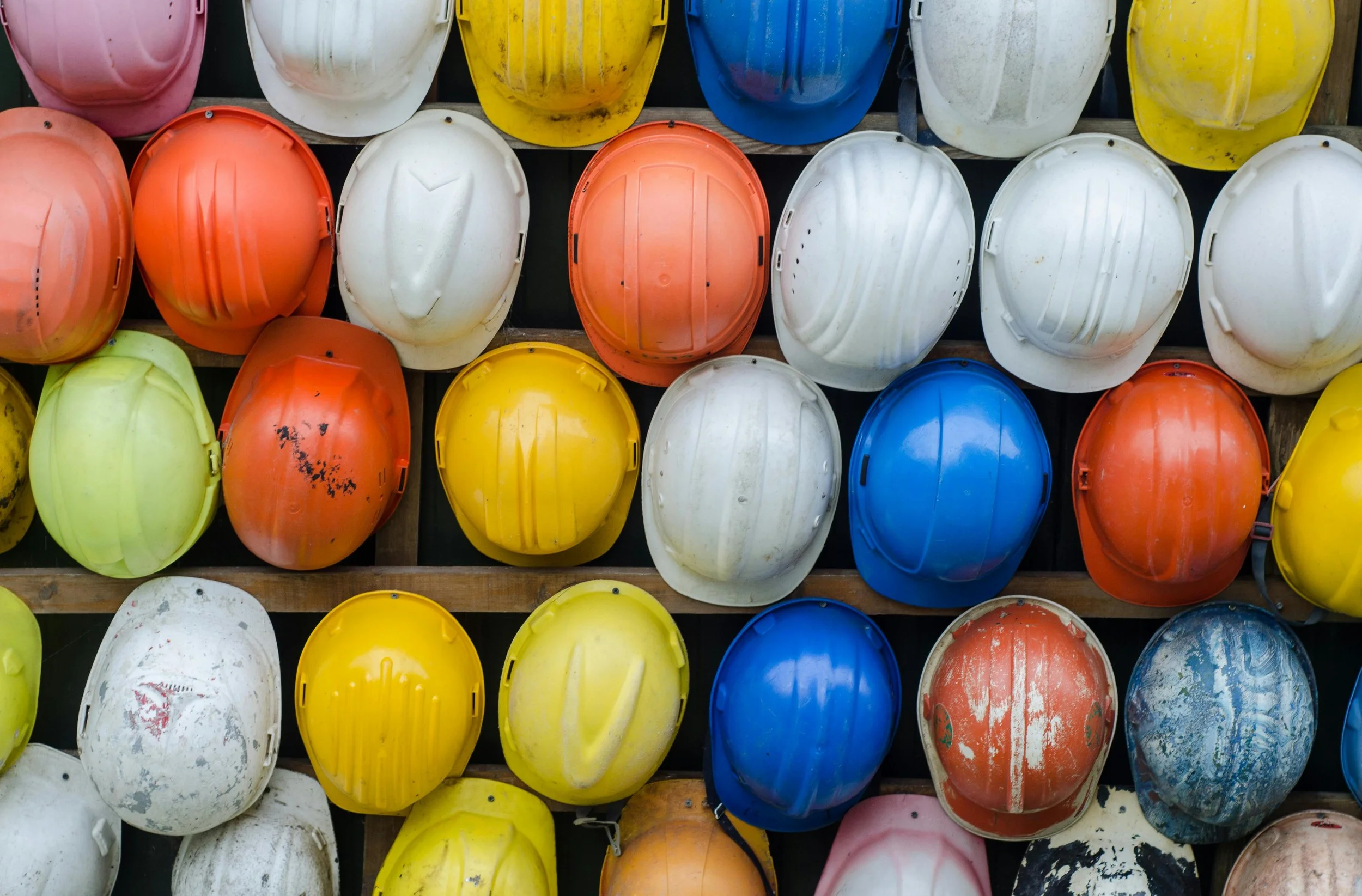 Rows of colorful hard hats