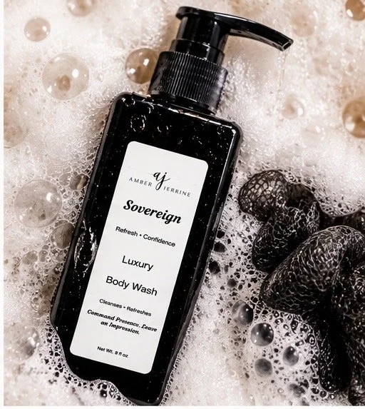 Amber Jerrine Sovereign Luxury Body Wash in a black 8 oz pump bottle surrounded by rich, creamy lather and bubbles.
