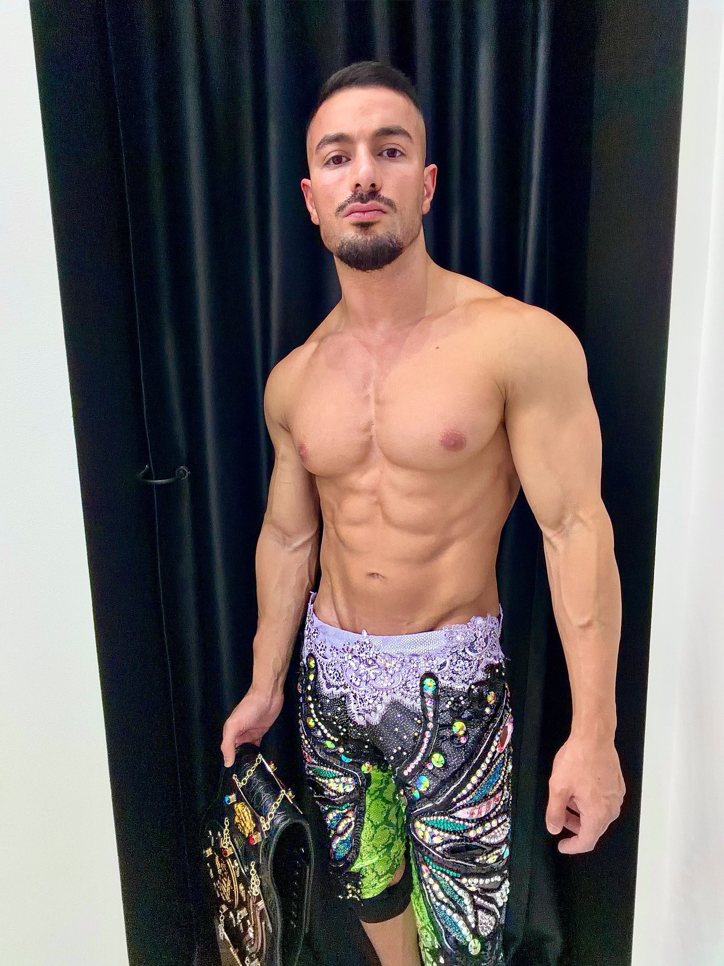 Australian wrestling legend @itsalbie, wearing colorful, sparkly pants with designs and embellishments.