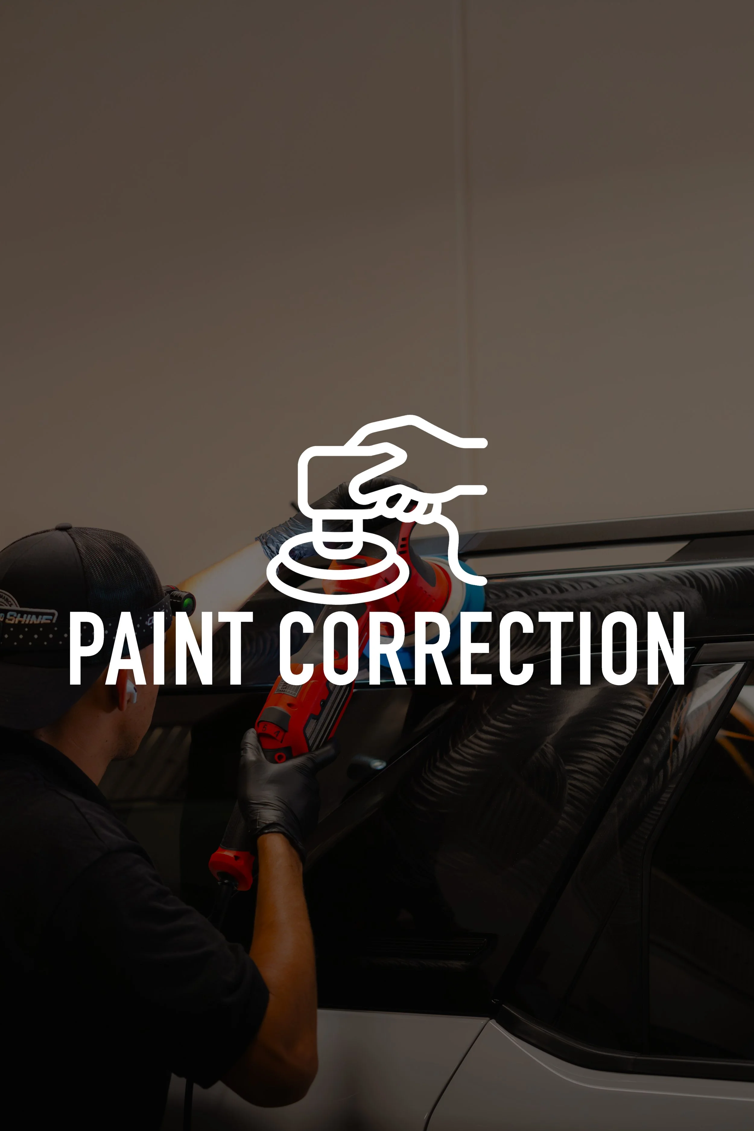Person using a power sander on a car with the text overlay 'Paint Correction'.