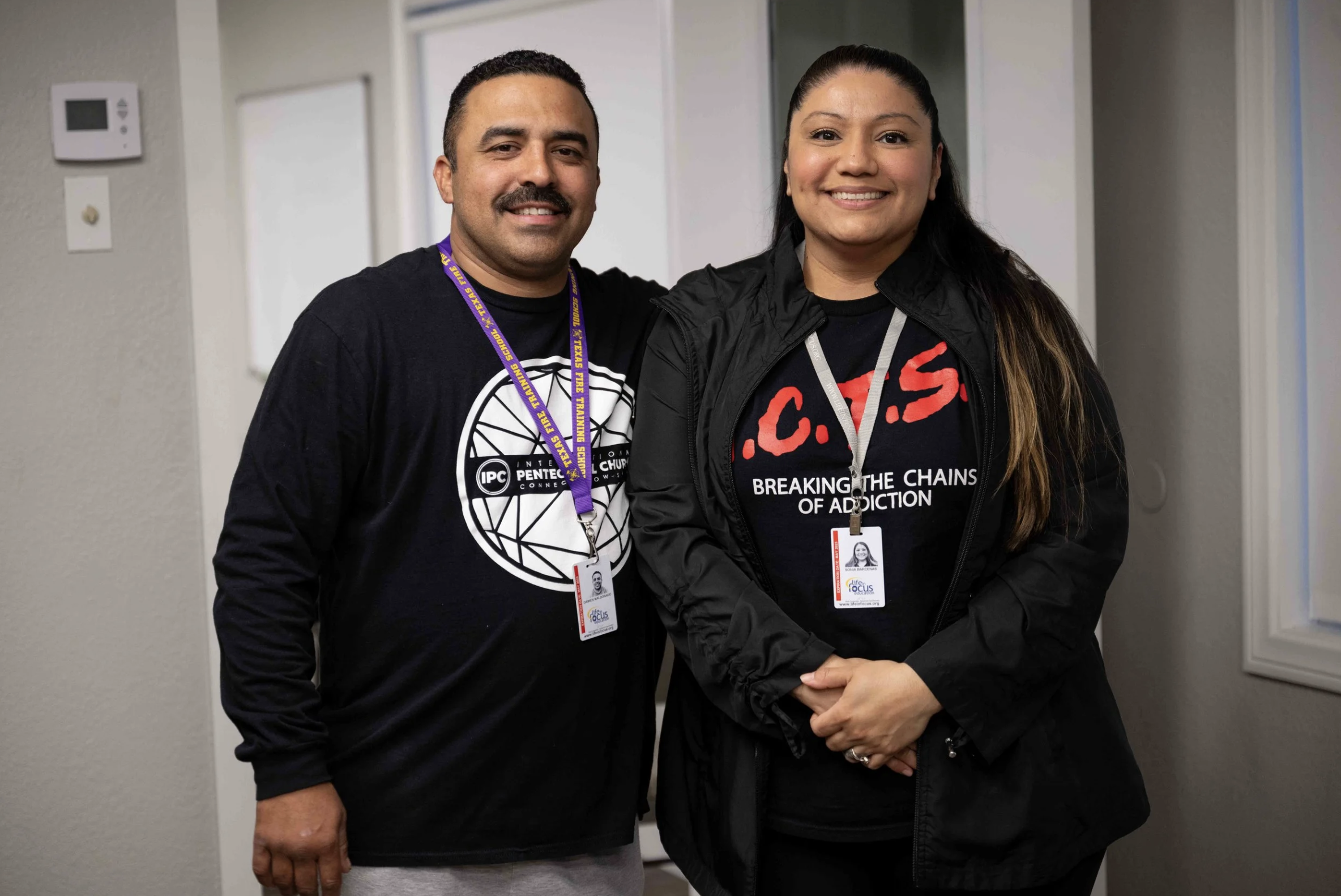 A man and a woman wearing ACTS Program shirts at International Pentecostal Church in Bellflower