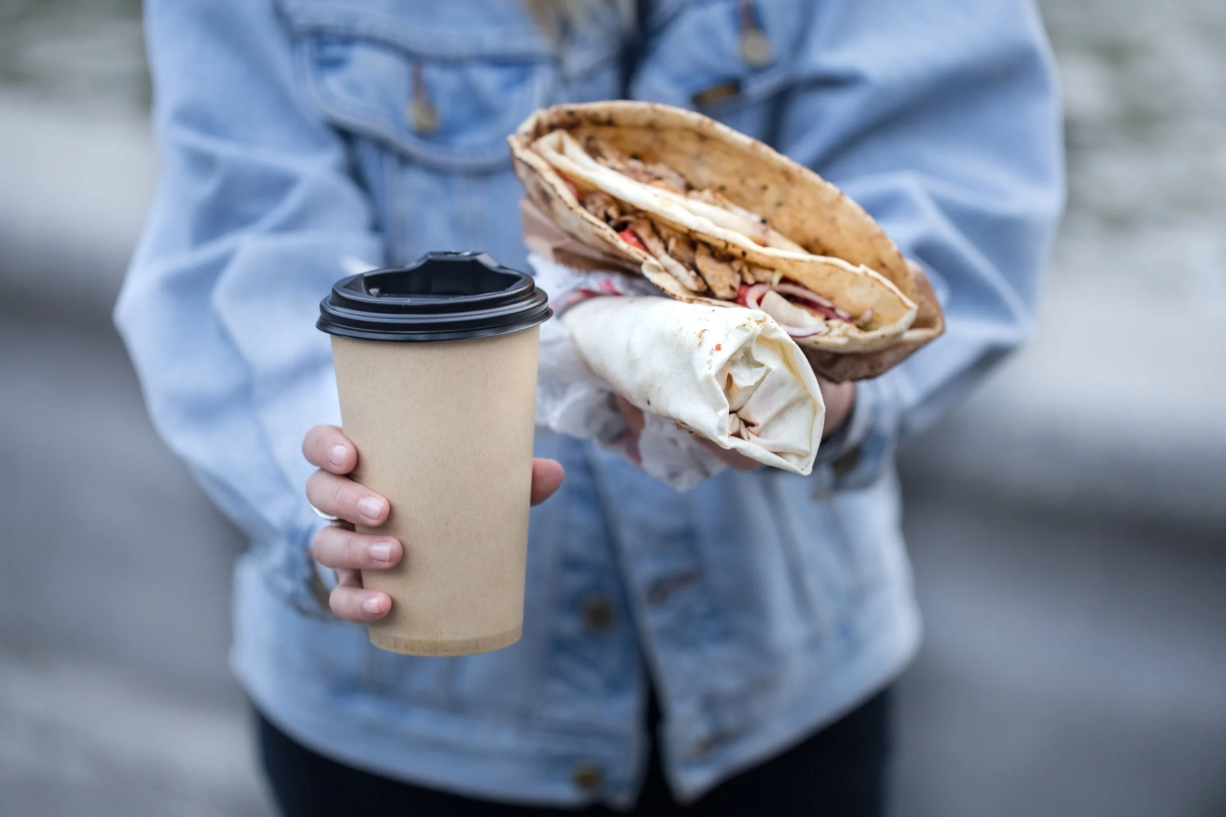 young-woman-holding-glass-coffee-fast-food.jpg