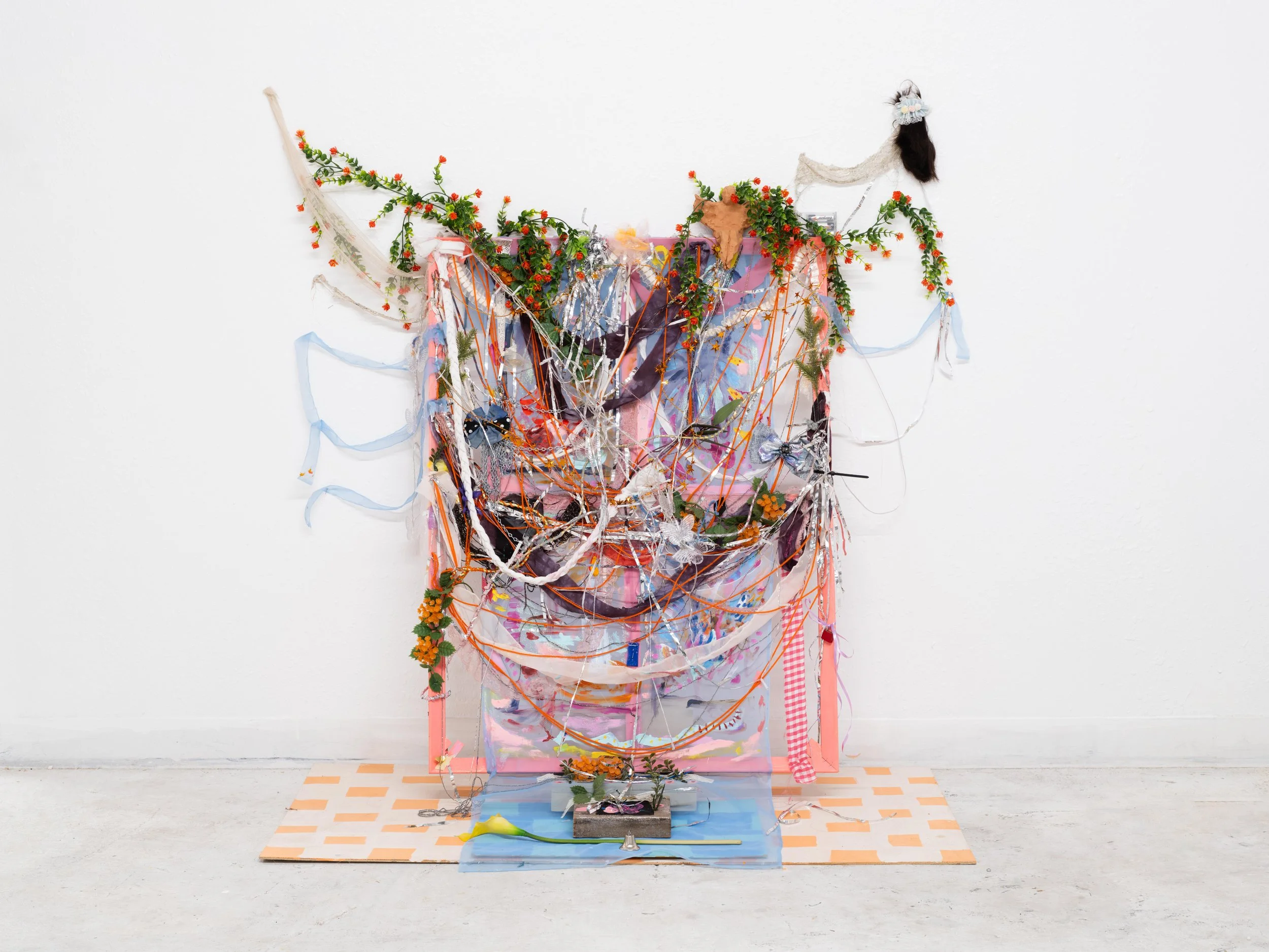 Something inside a garden or a cemetery

Wood, Acrylic paint, Yarn, Lace, Glitter, Chains, Hair-bows, Low-fire New Mexico Clay with human ash glaze, My hair more glitter?

2026