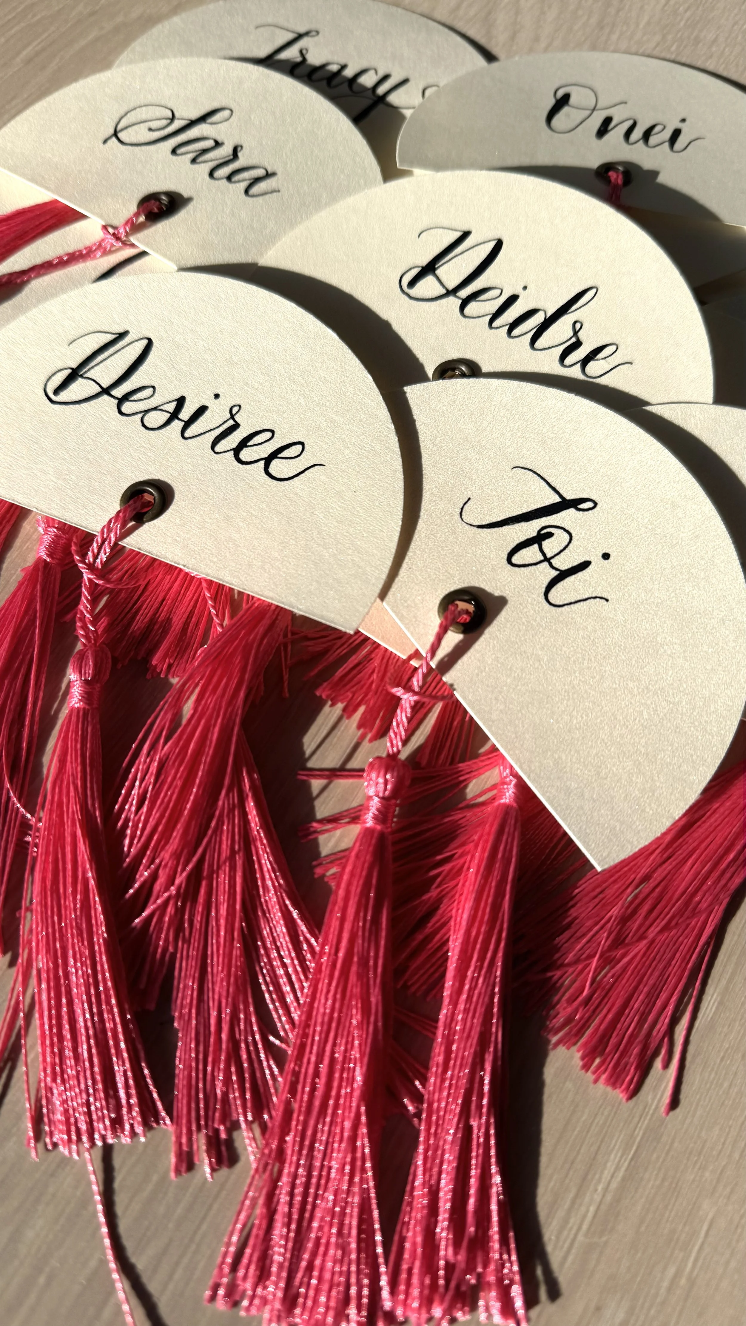 Custom pointed-pen calligraphy place cards, favors, escort cards with tassels
