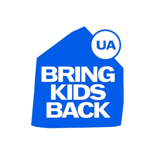 Purple baggage tag with text 'UA BRING KIDS BACK' and a circular 'UA' logo.