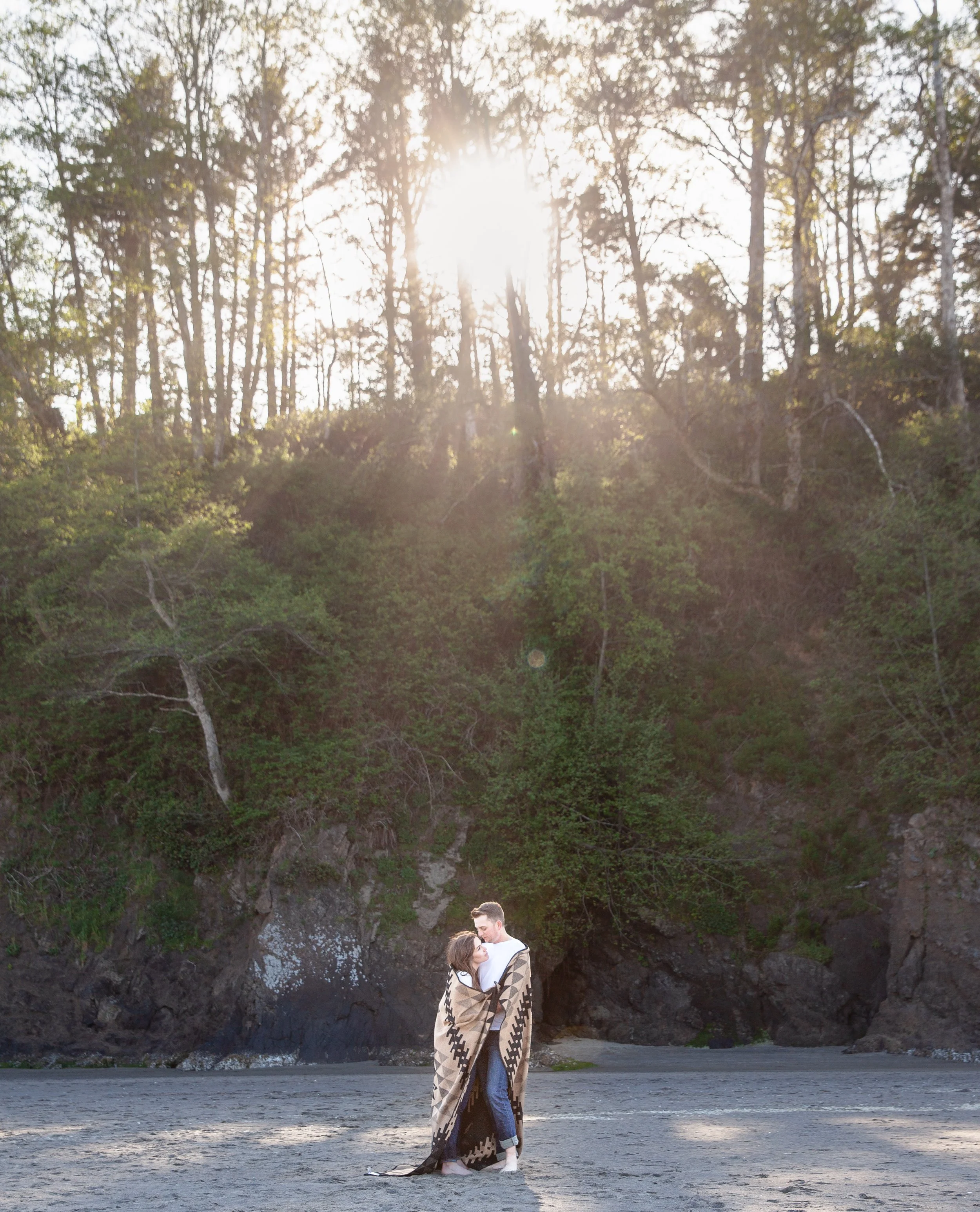 Romantic engagement portraits documenting genuine connection beside the Pacific Ocean. Oregon Coast.