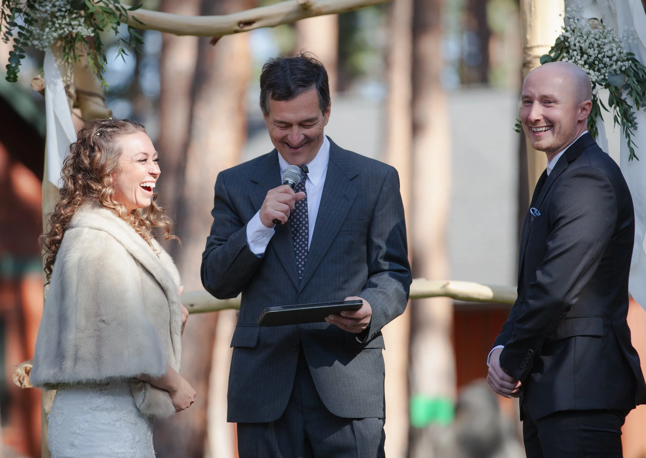 Outdoor wedding ceremony beneath towering pine trees in Central Oregon. Five Pines Lodge. Sisters Oregon. 