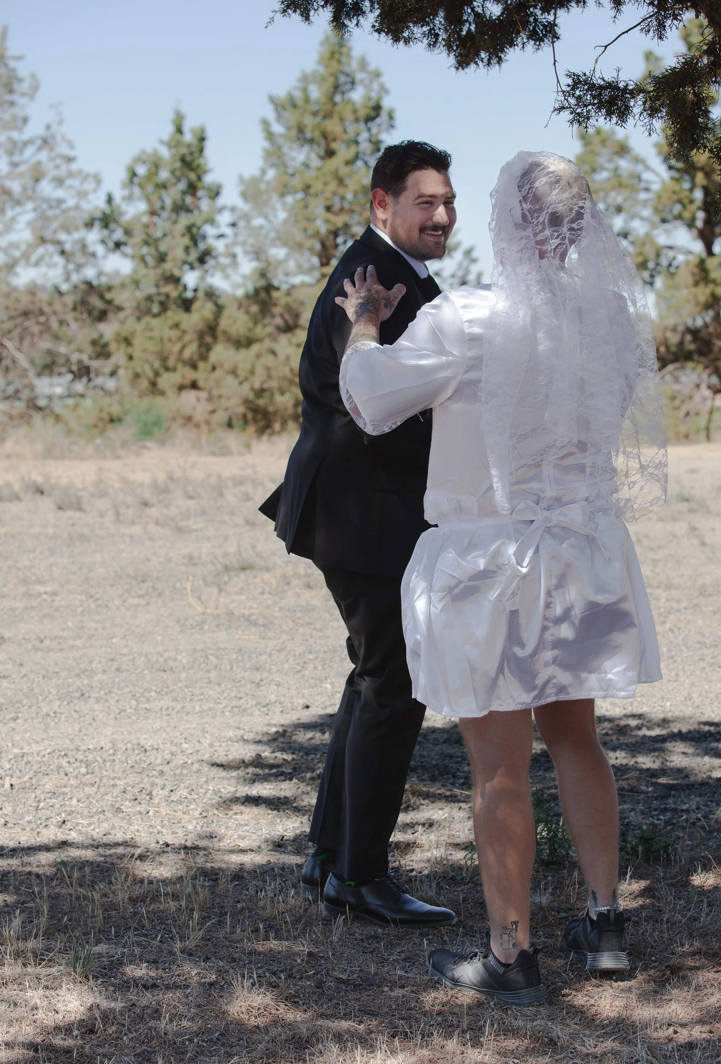  Groom's best friend surprising him during a first-look prank at a Central Oregon ranch wedding 