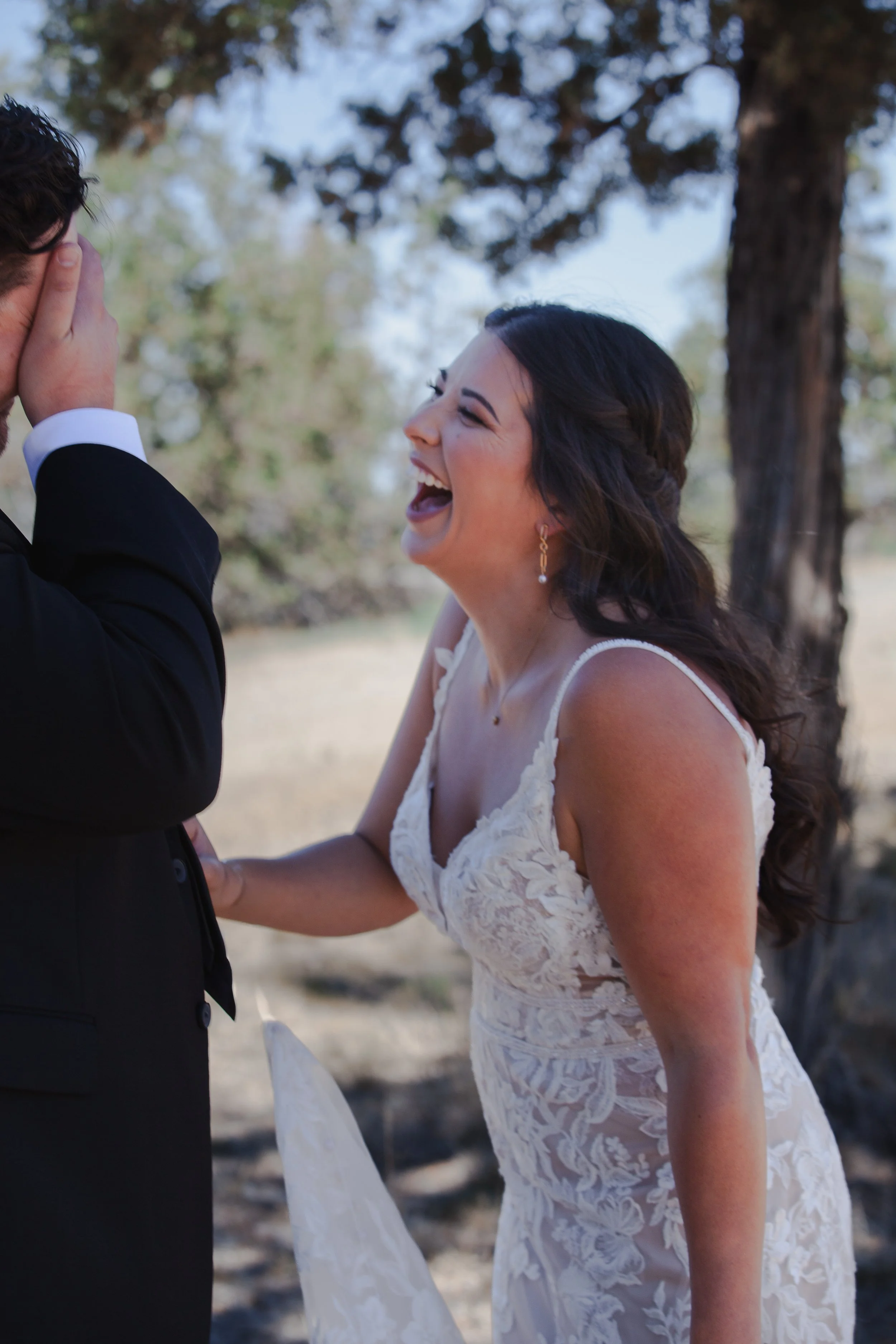  Bride laughing during a playful first-look prank at her private ranch wedding in Bend, Oregon 