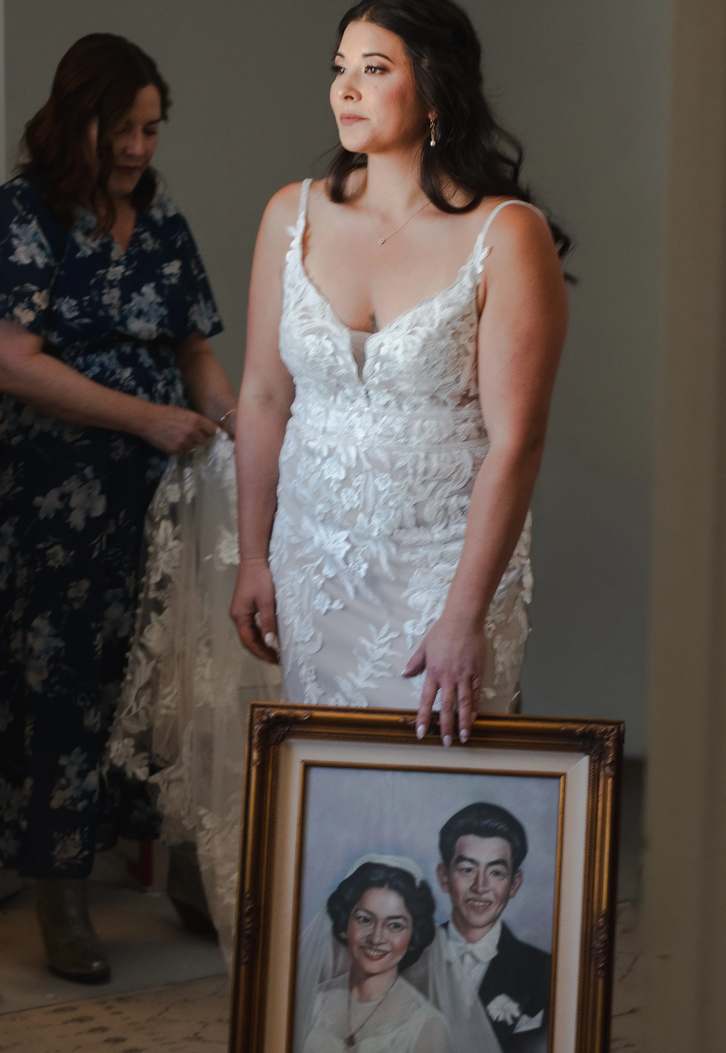  Bride photographed with an antique portrait of her grandparents while getting ready for her Bend, Oregon wedding 