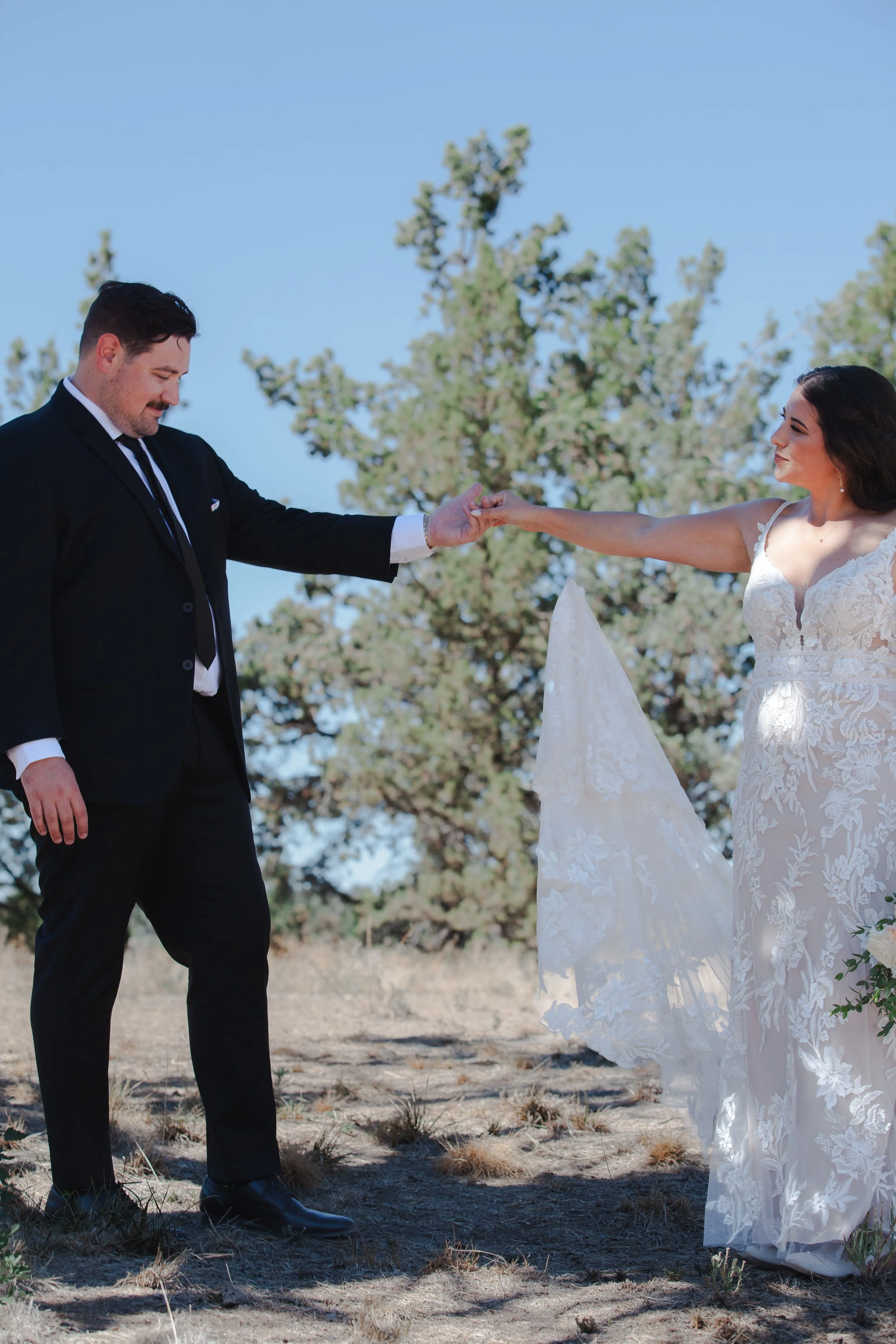  Bride and groom sharing a quiet moment before their outdoor ranch wedding ceremony in Central Oregon 