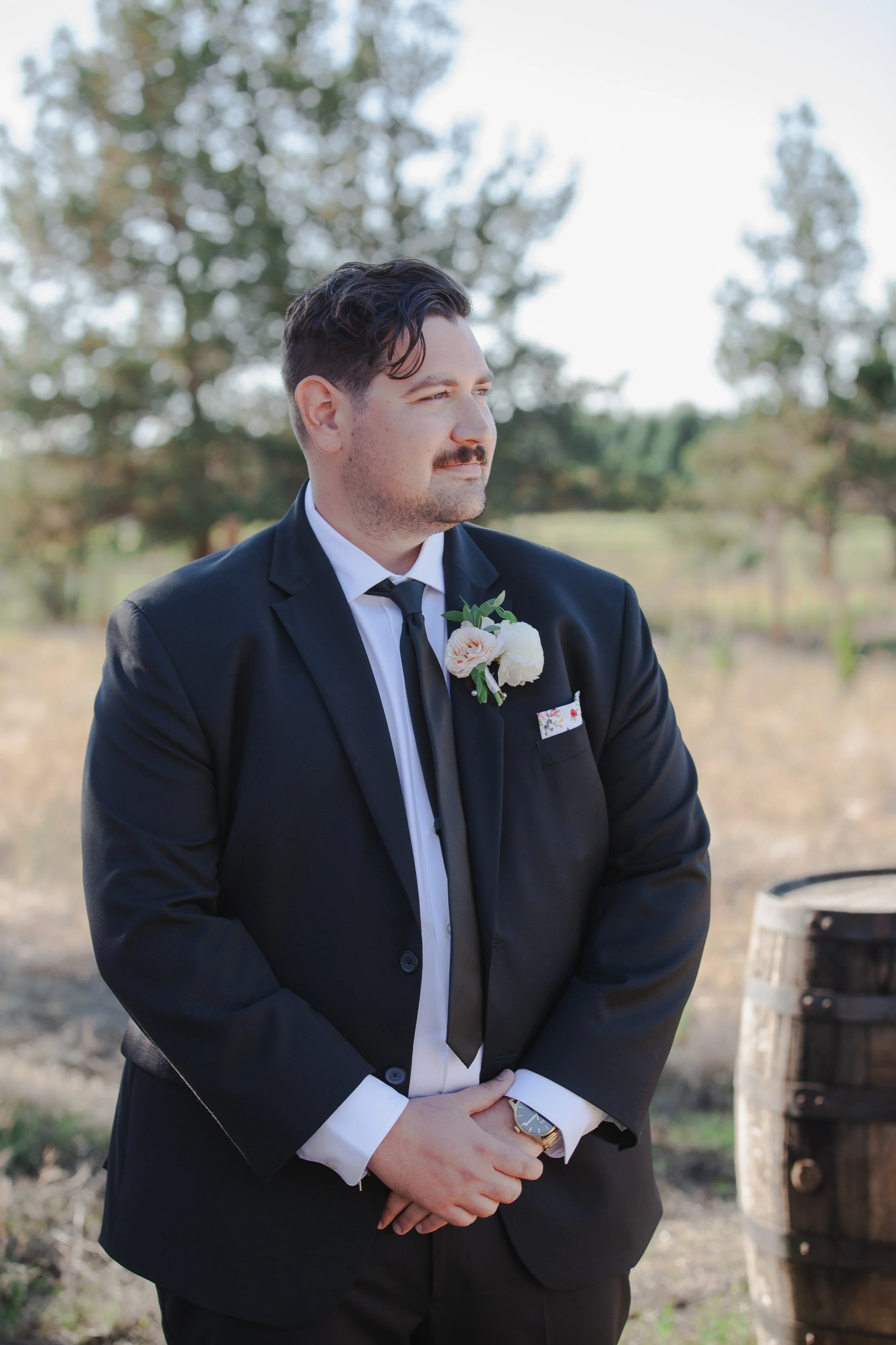  Groom watching his bride walk down the aisle at their private ranch wedding in Central Oregon 