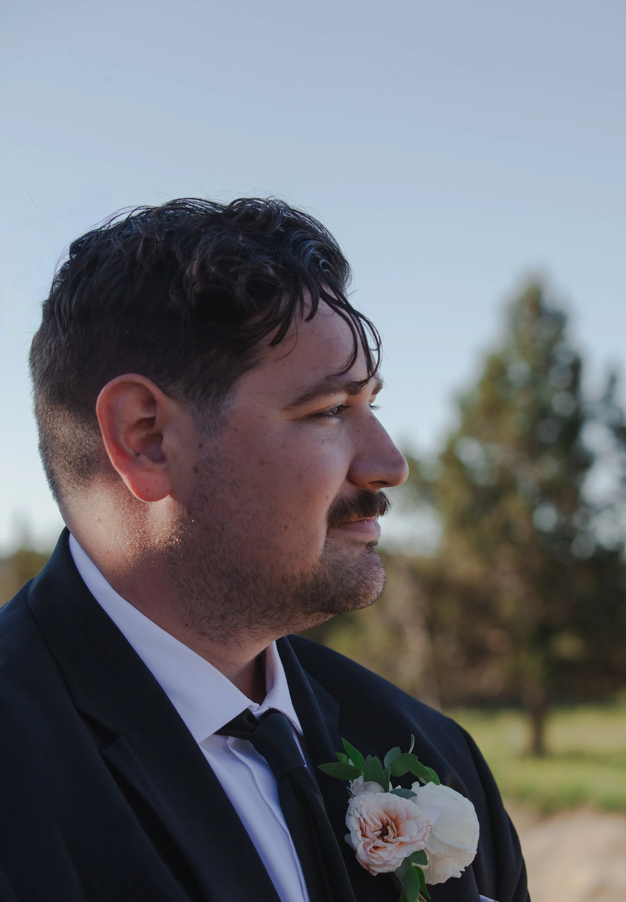  Groom watching his bride walk down the aisle at their private ranch wedding in Central Oregon 