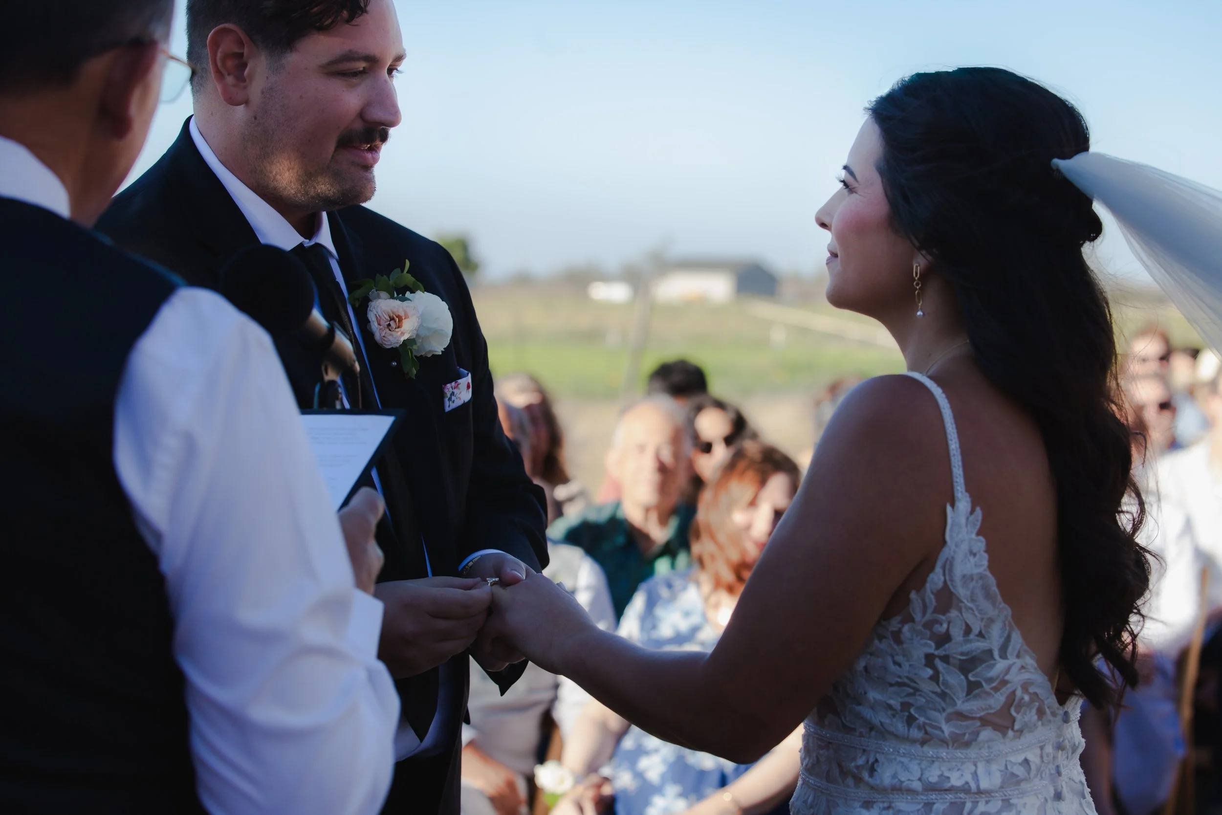  Close-up of the couple exchanging wedding rings during their private ranch ceremony in Central Oregon 