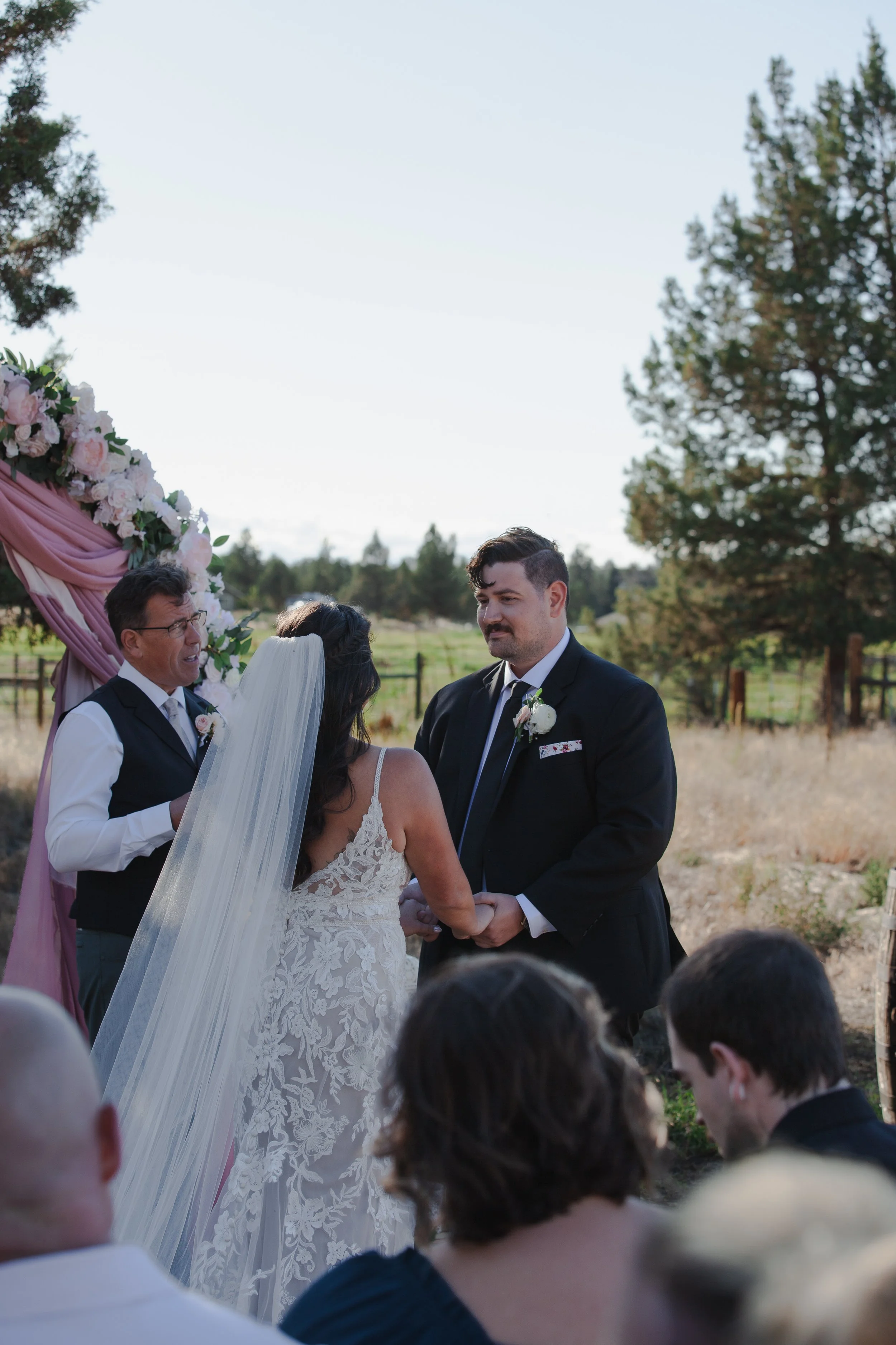  Emotional wedding vows during a faith-centered outdoor ceremony in Bend, Oregon 