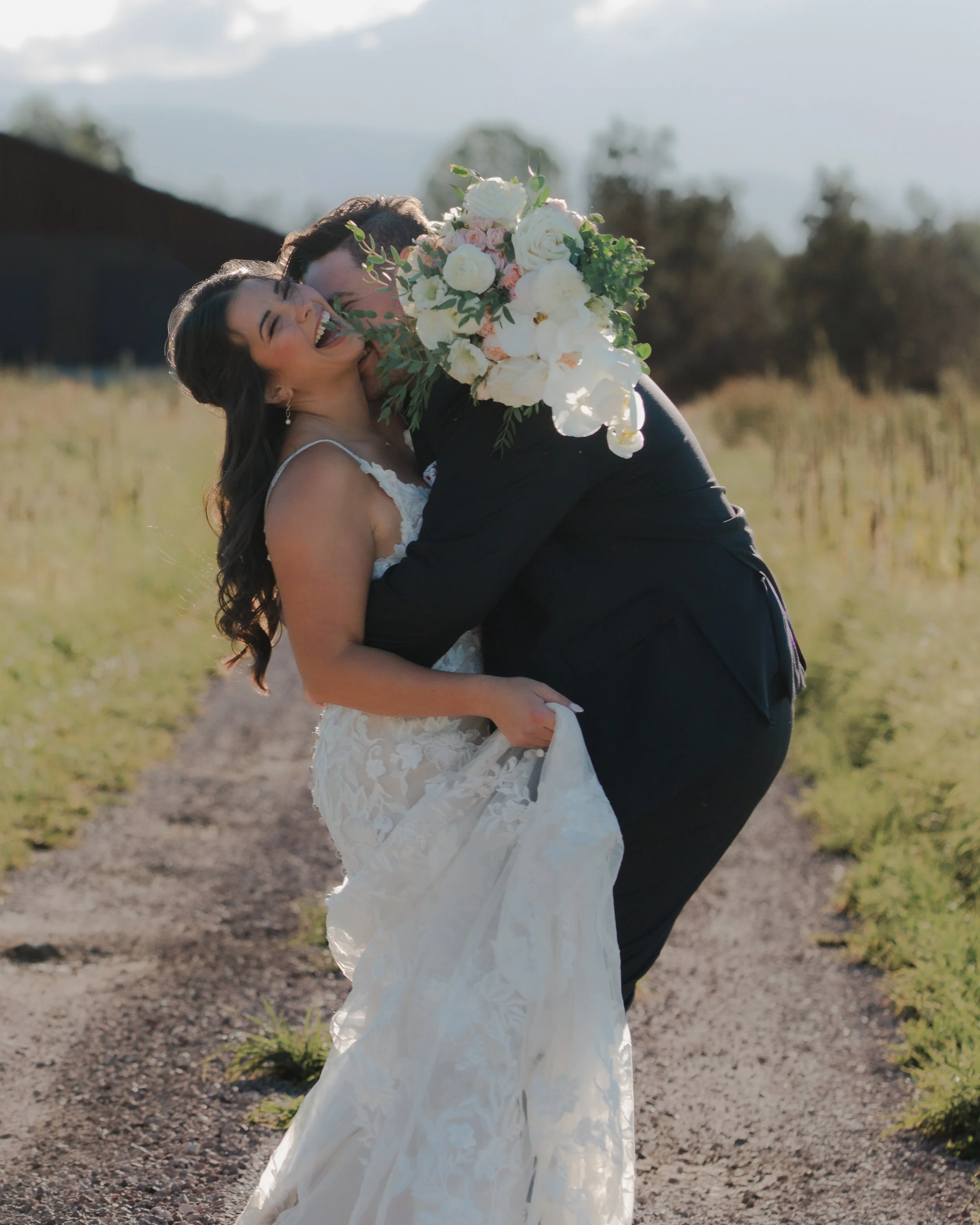  Editorial bridal portraits with white flowers and mountain views at a private ranch wedding in Central Oregon 