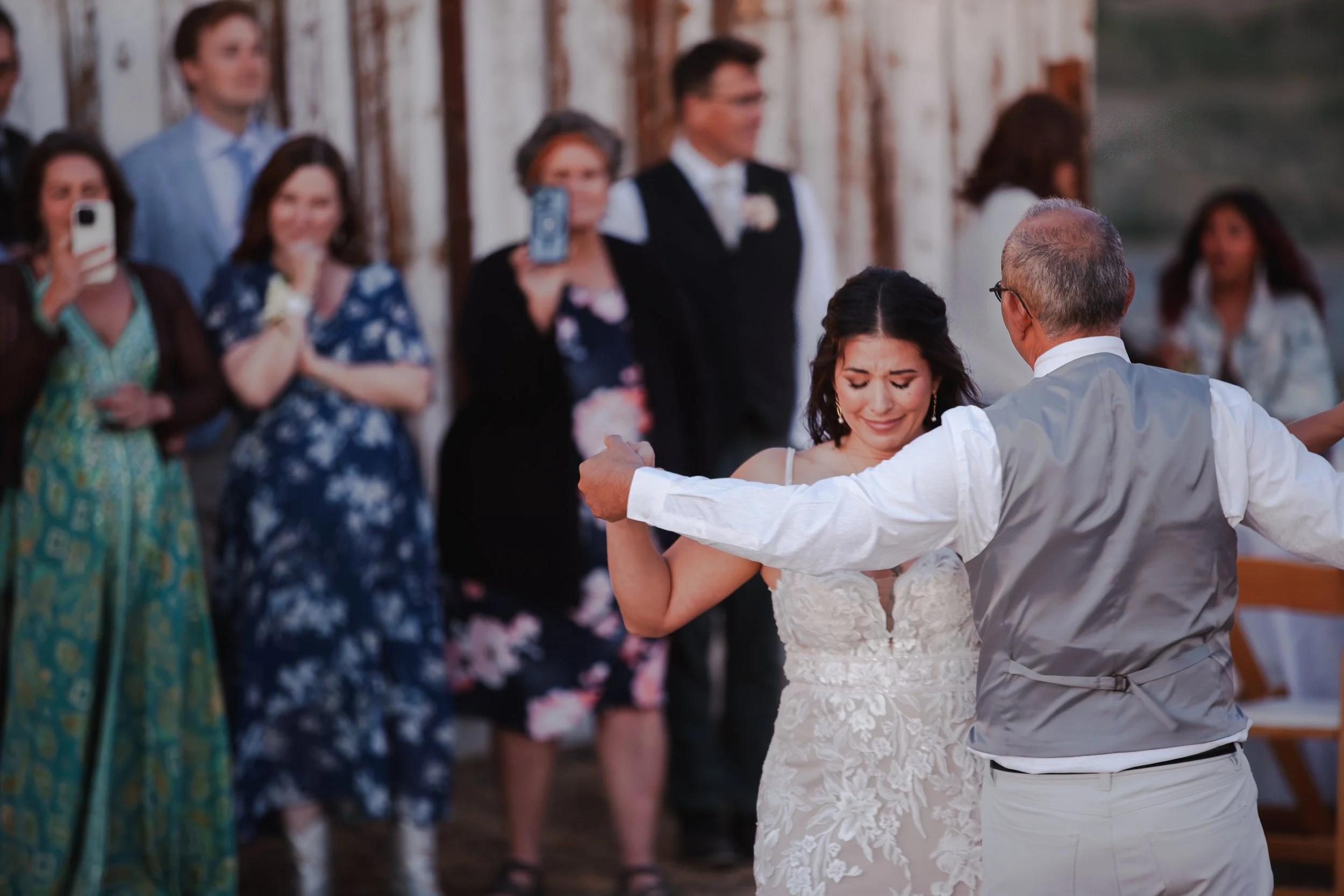  Bride and groom dancing beneath string lights at their private ranch wedding reception near Bend, Oregon 