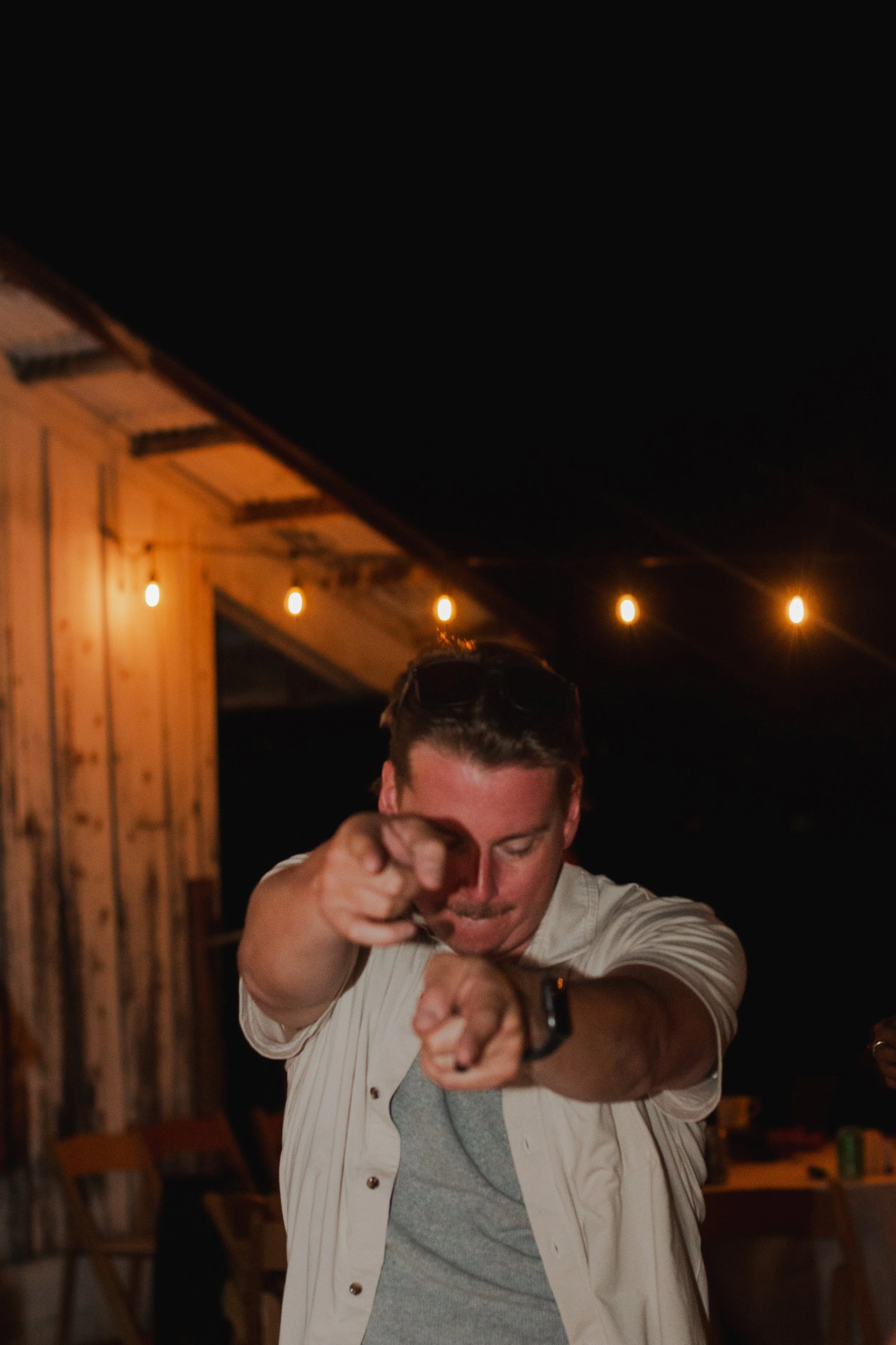  Wedding guests celebrating on the dance floor during a summer ranch wedding in Central Oregon 