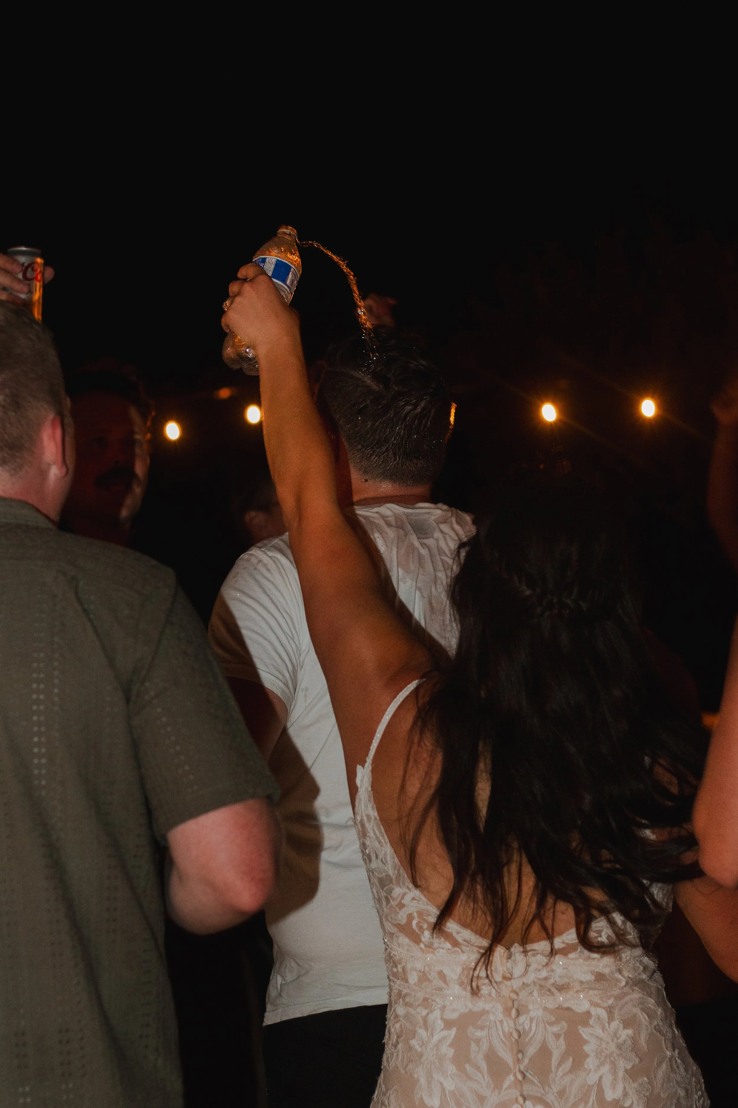  Bride and groom dancing beneath string lights at their private ranch wedding reception near Bend, Oregon 