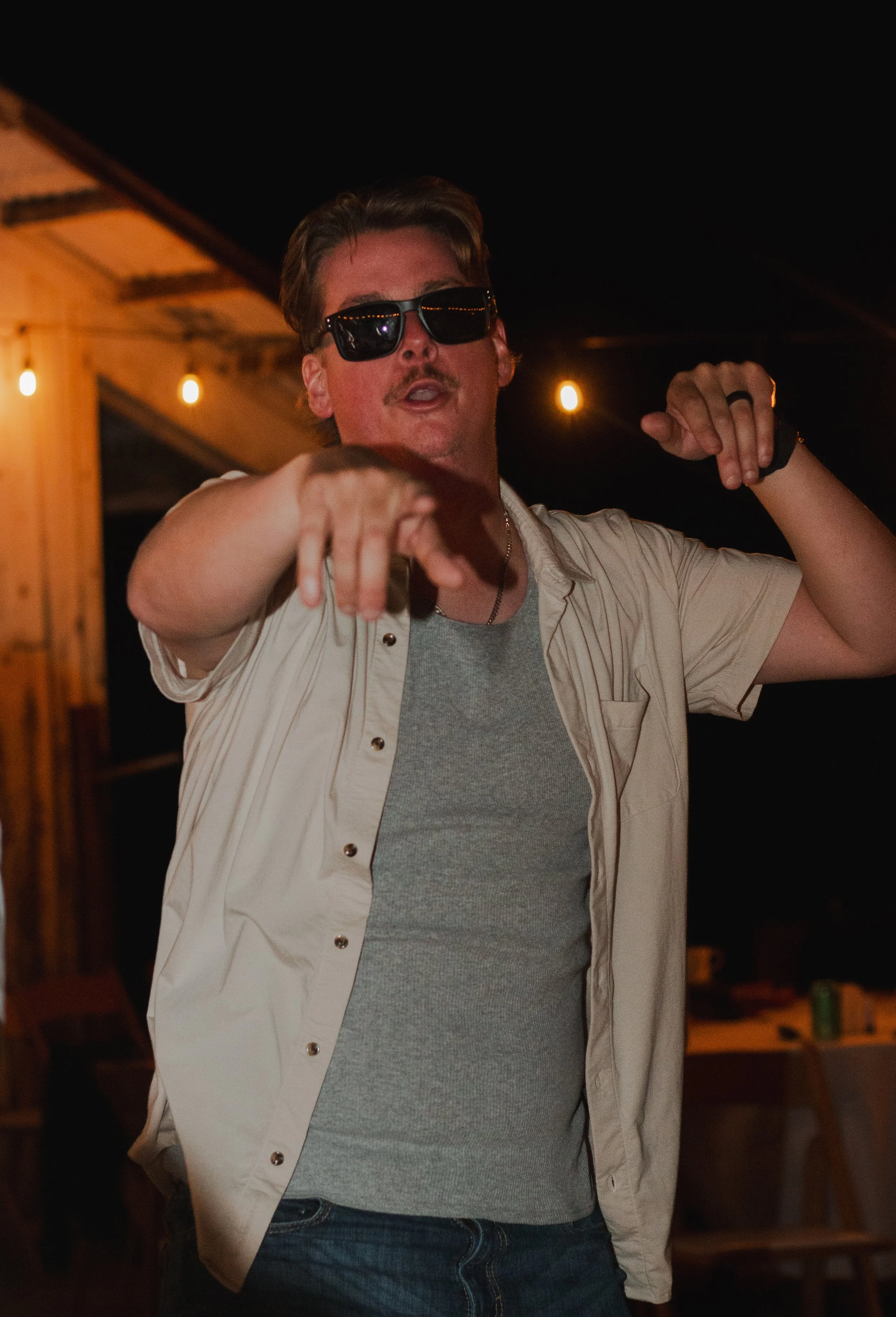  Wedding guests celebrating on the dance floor during a summer ranch wedding in Central Oregon 