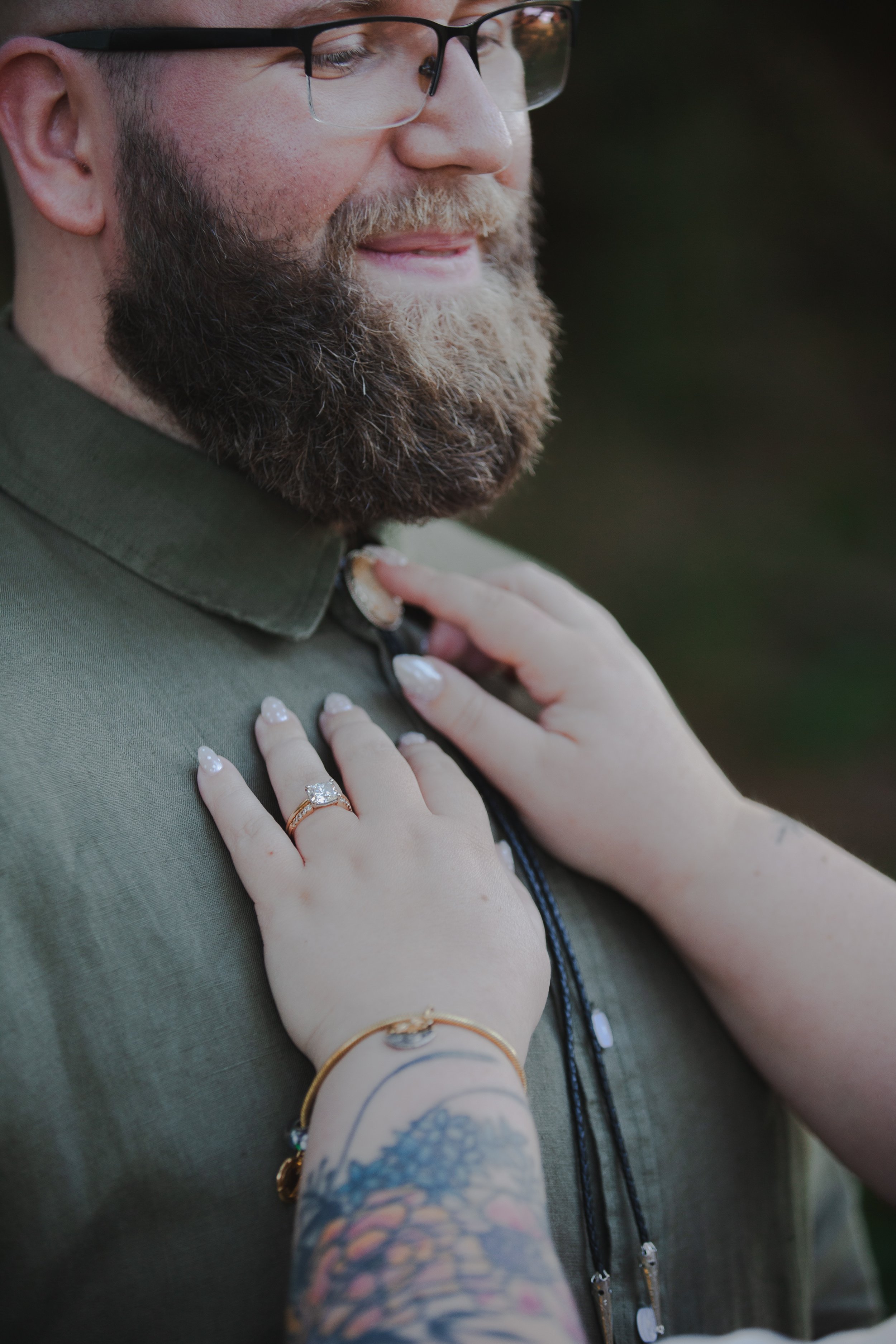 Romantic engagement portrait in tall grass overlooking the Oregon Coast