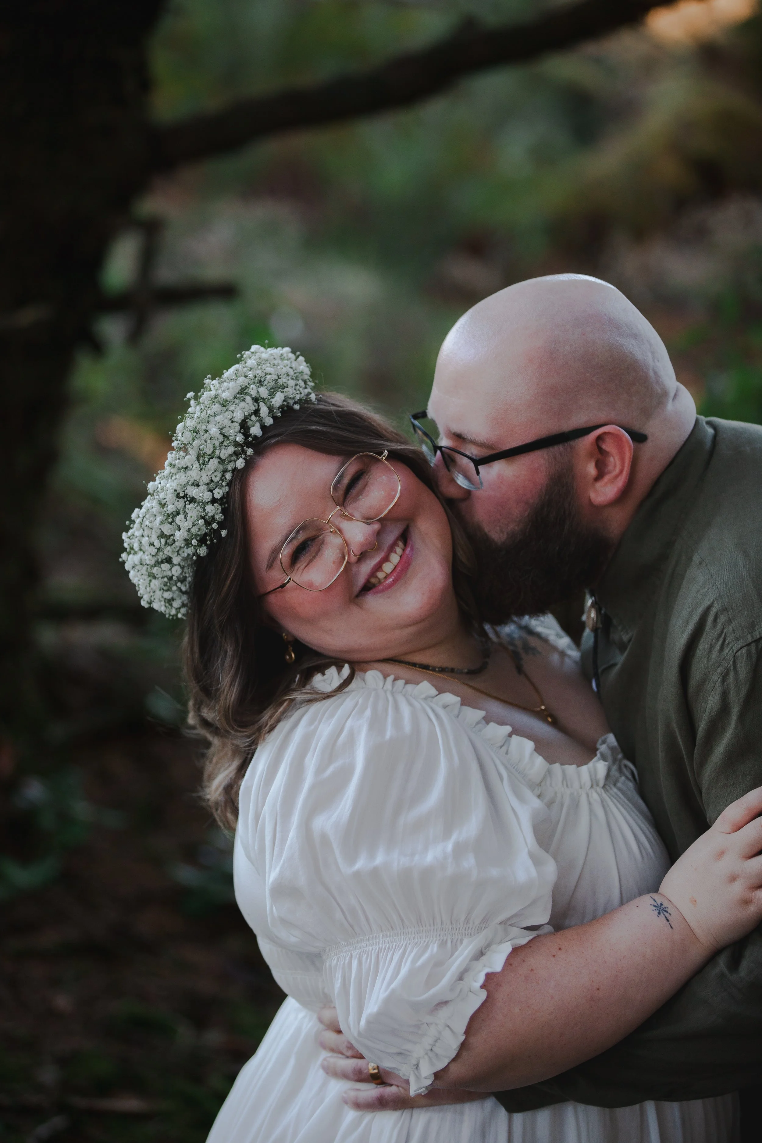 Manzanita Oregon engagement session with couple walking through lush coastal forest