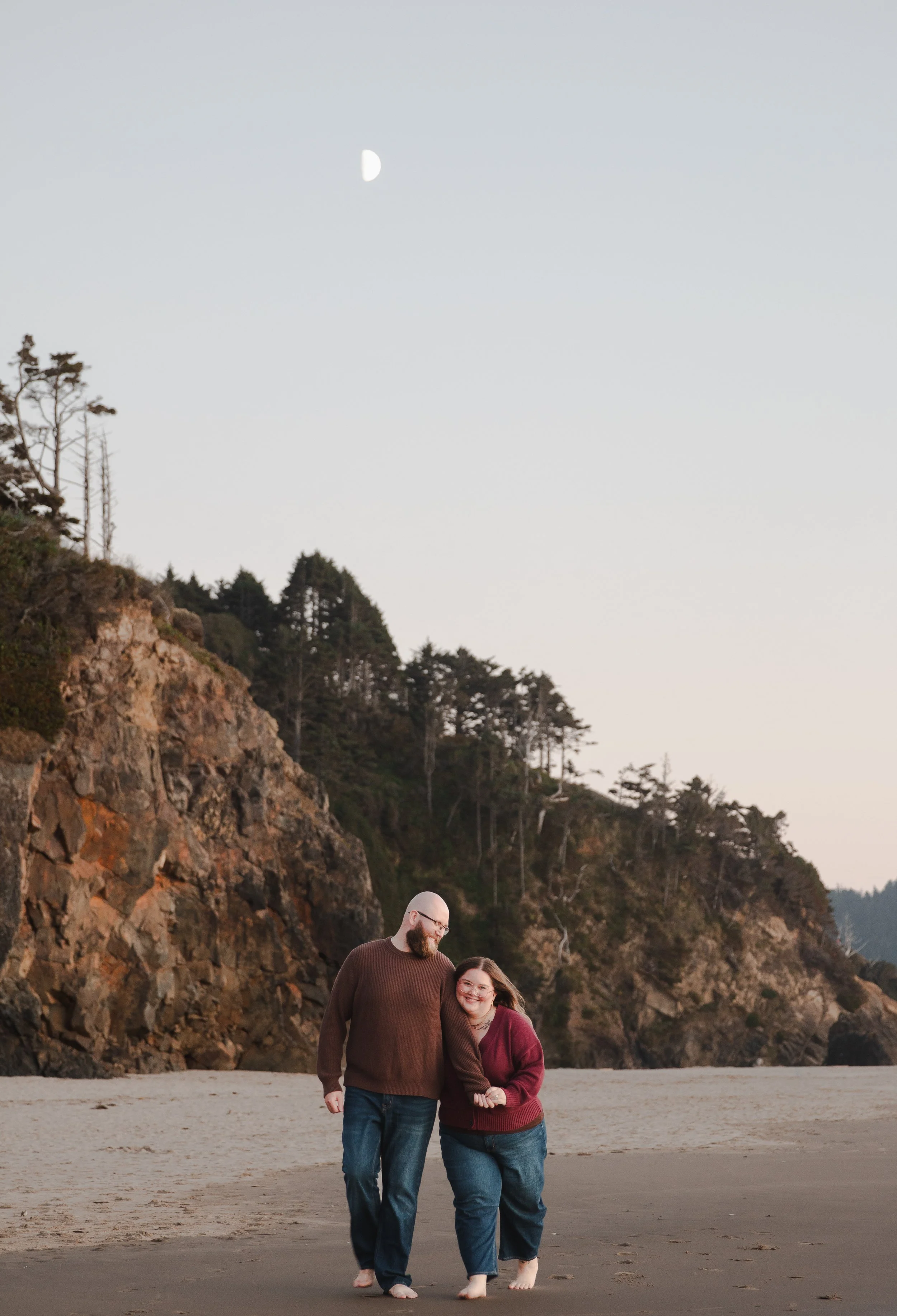 Cozy sunset engagement portrait on Manzanita Beach