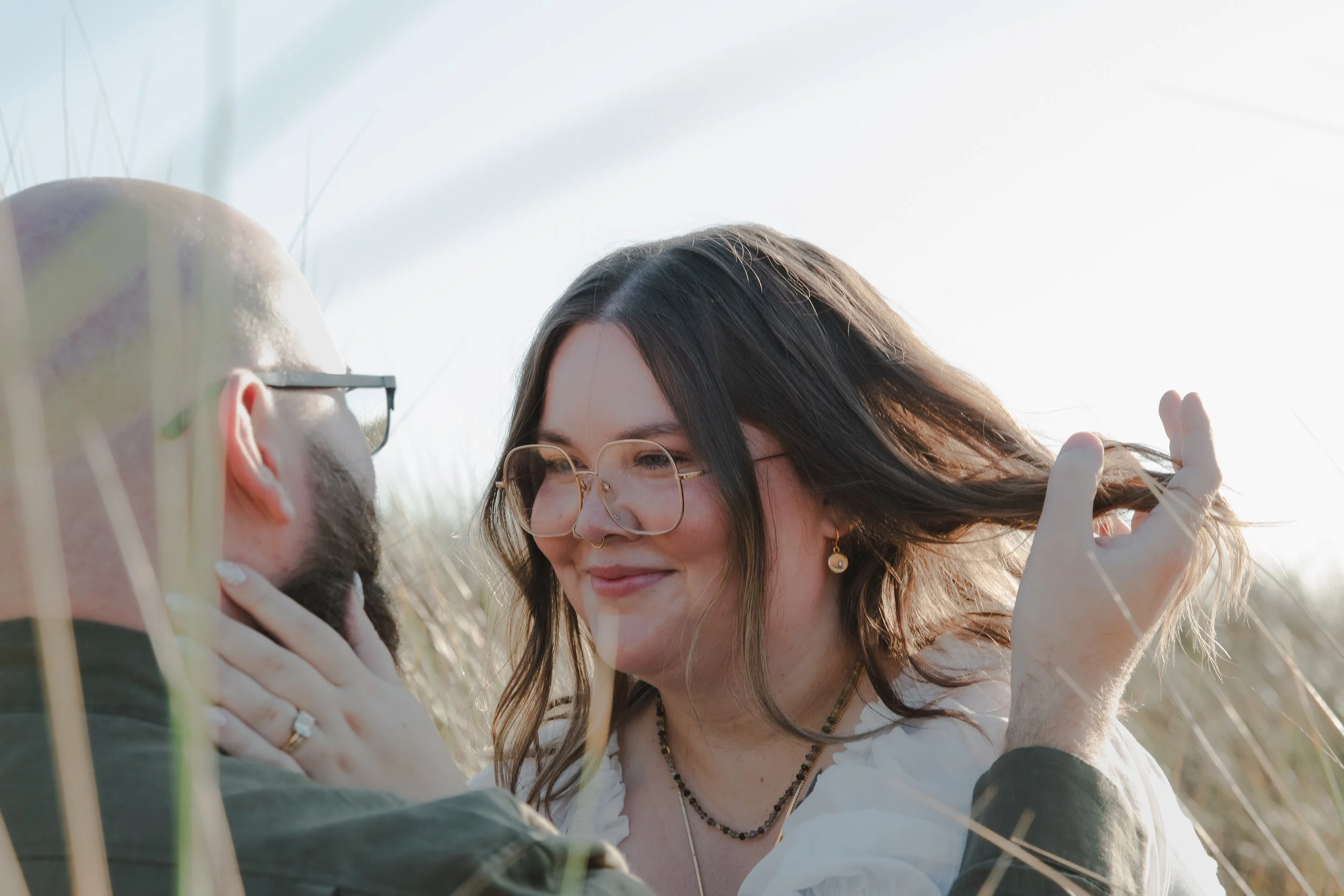 Manzanita engagement photography with couple on sandy coastal bluffs