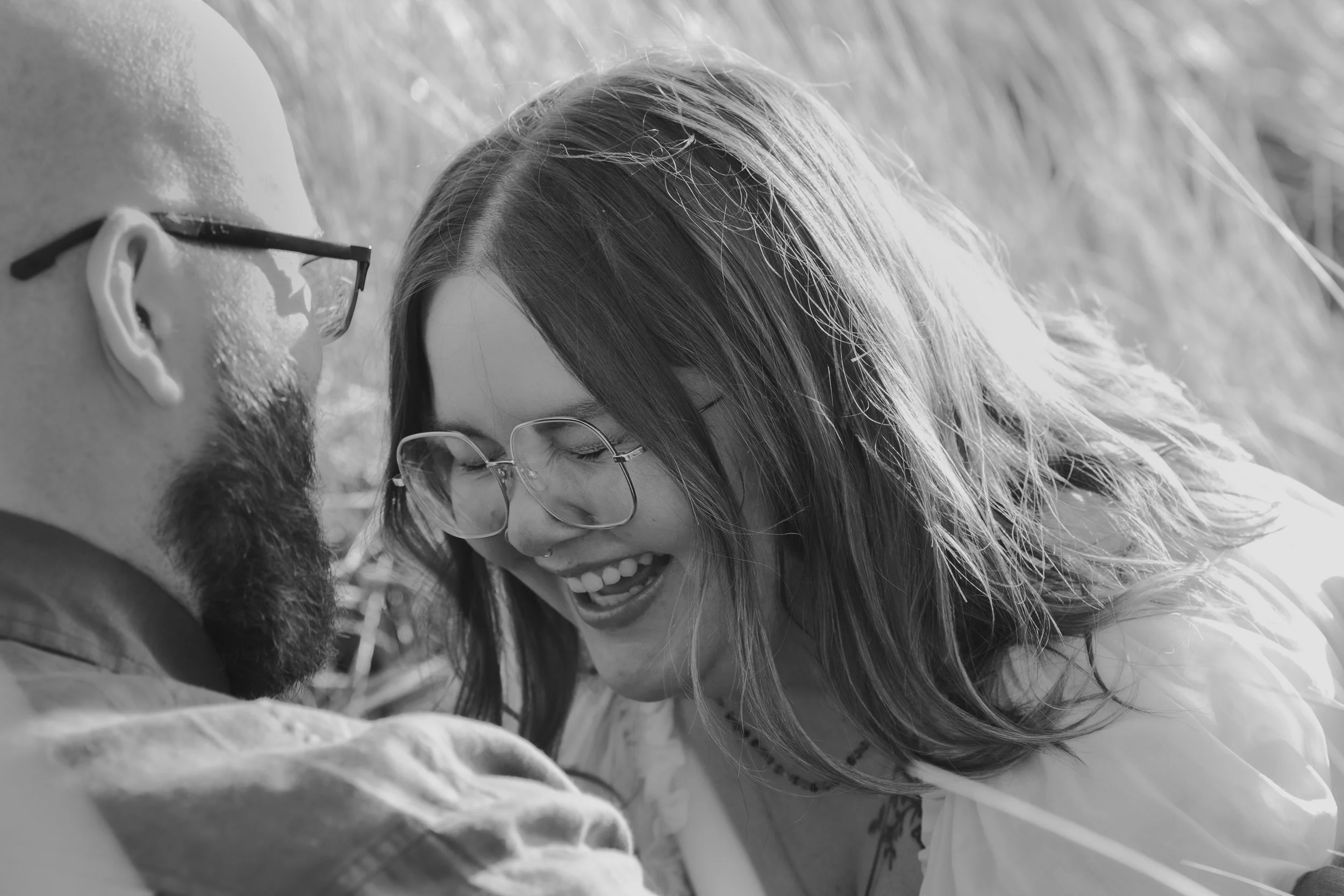 Cinematic engagement portrait on grassy bluffs near Manzanita Oregon