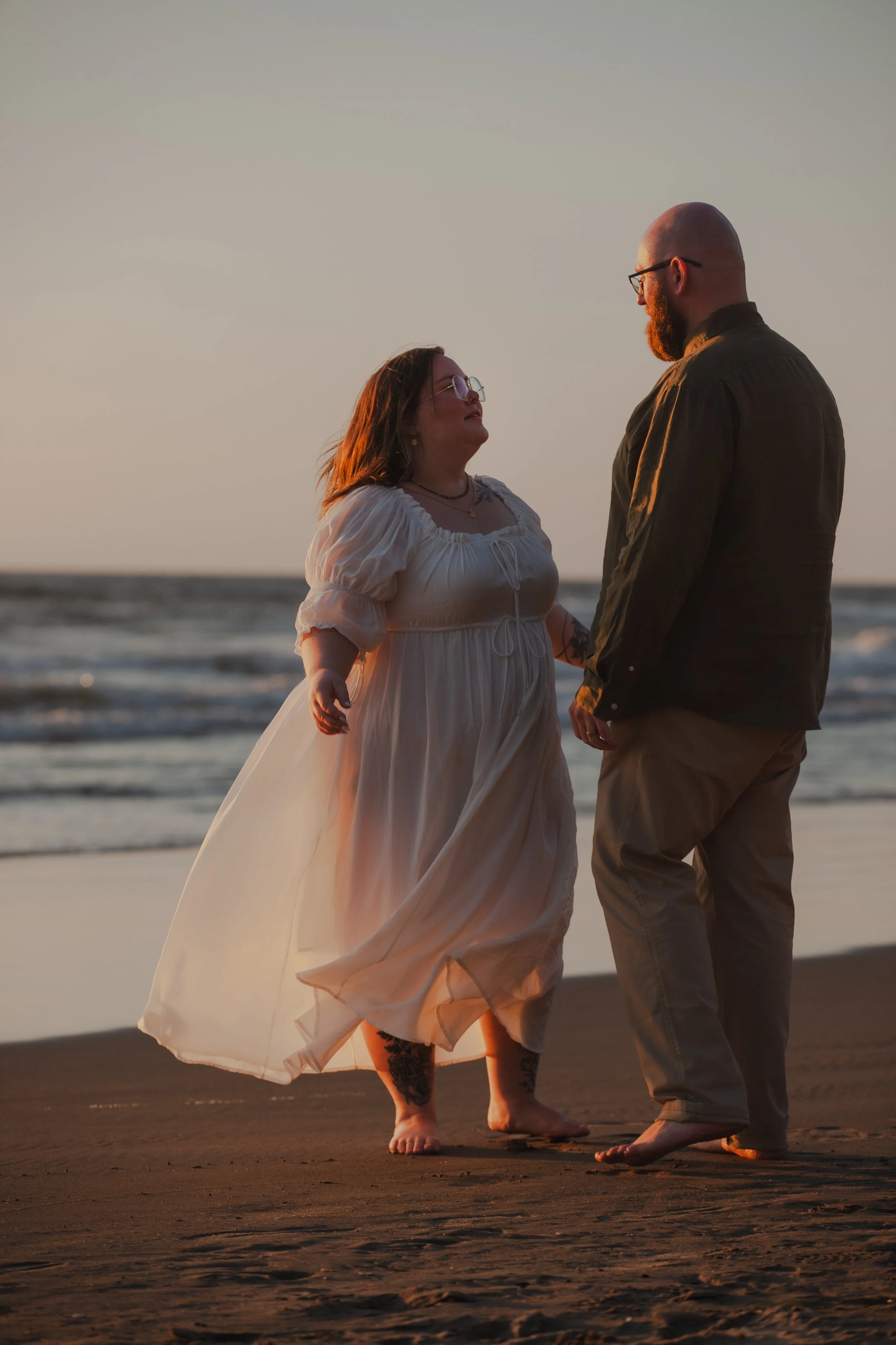 Hug Point Oregon engagement portrait with couple surrounded by dramatic coastal scenery