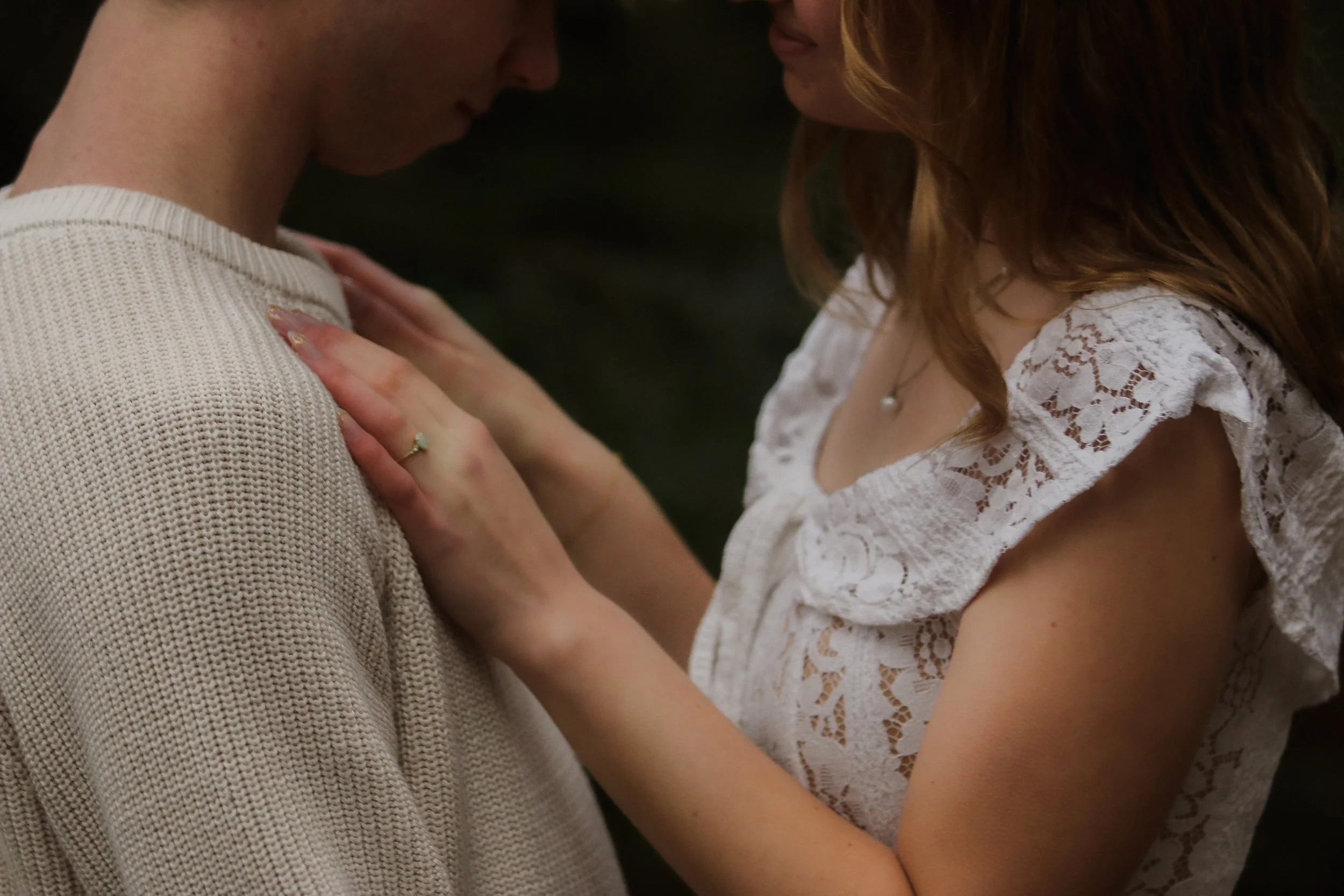 Bride and groom sharing a quiet moment during their forest engagement session in Camp Sherman, Oregon.