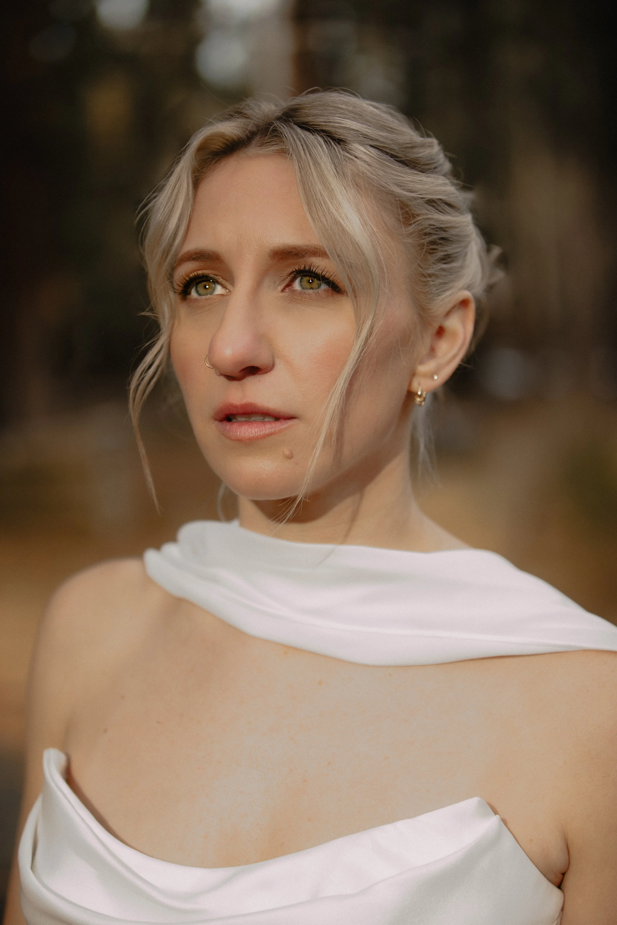 Cinematic bridal portrait in warm forest light during a winter wedding editorial in Central Oregon.