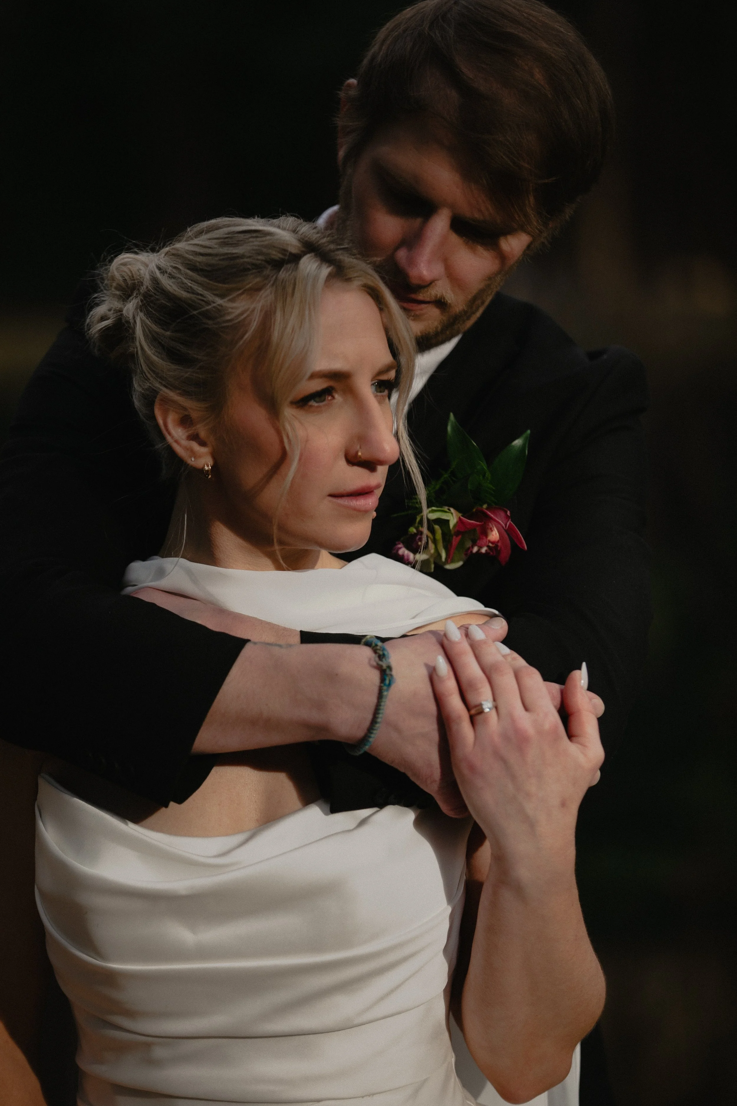Bride and groom embracing in warm winter light during a Central Oregon wedding editorial.