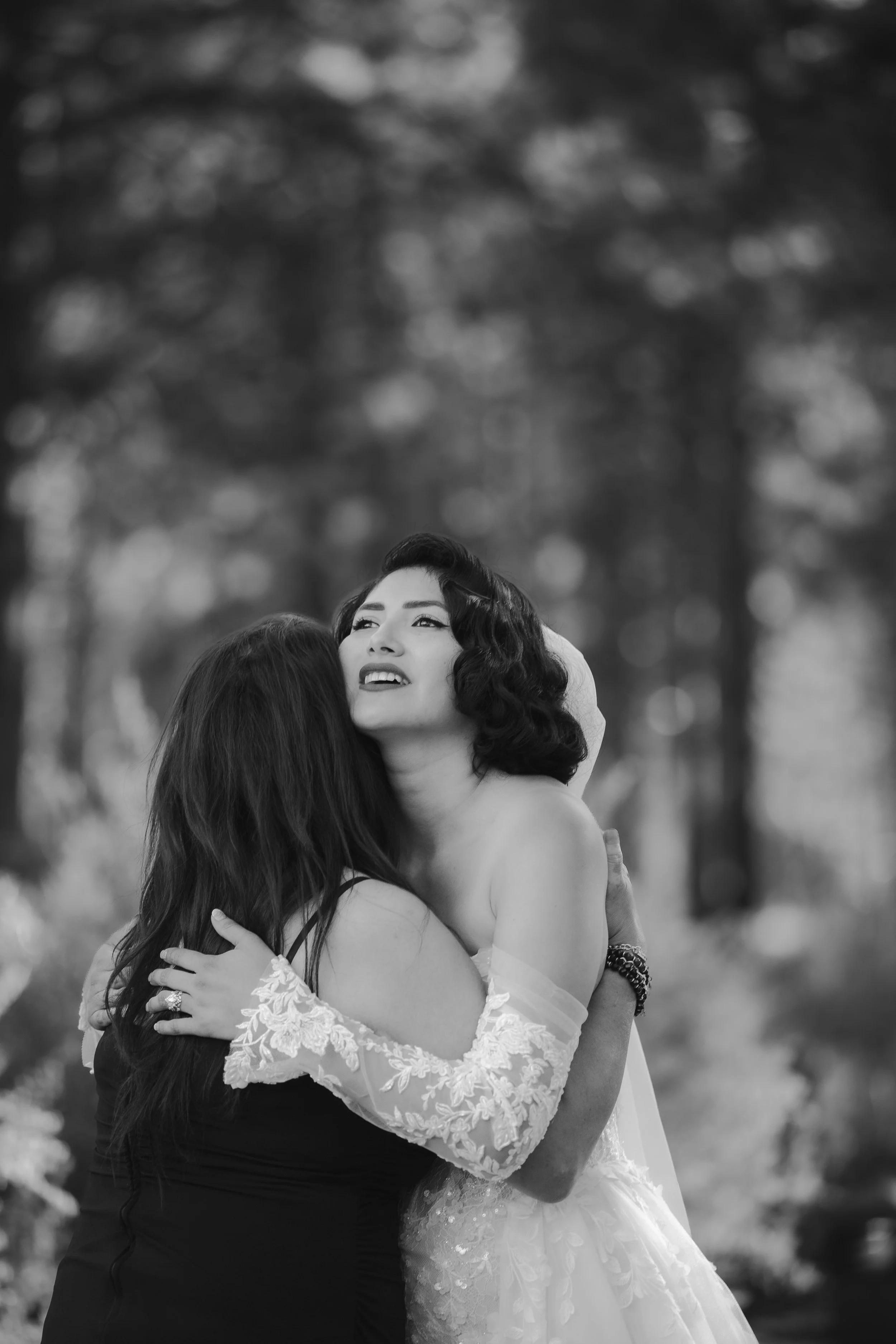 Bride embracing a loved one during an intimate High Desert Museum wedding in Central Oregon