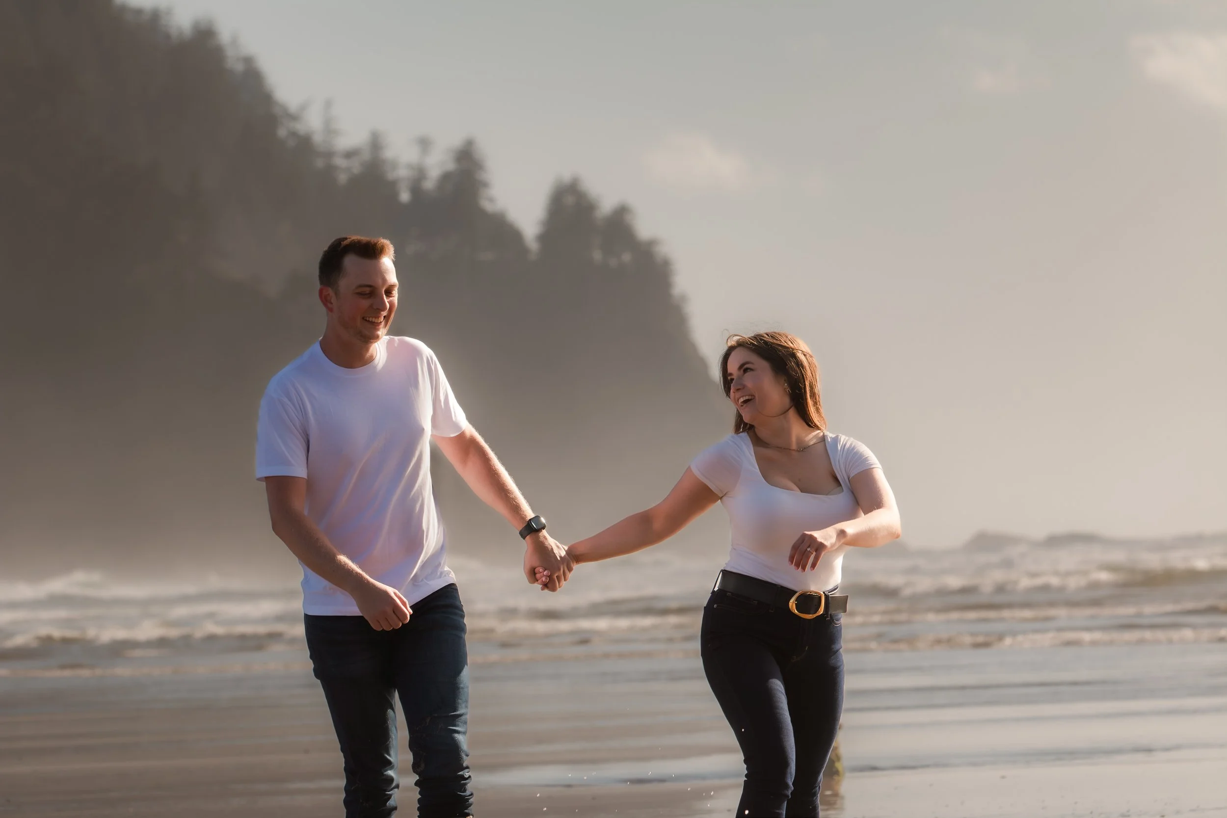 Candid engagement photography celebrating the moments between poses. Oregon Coast. 