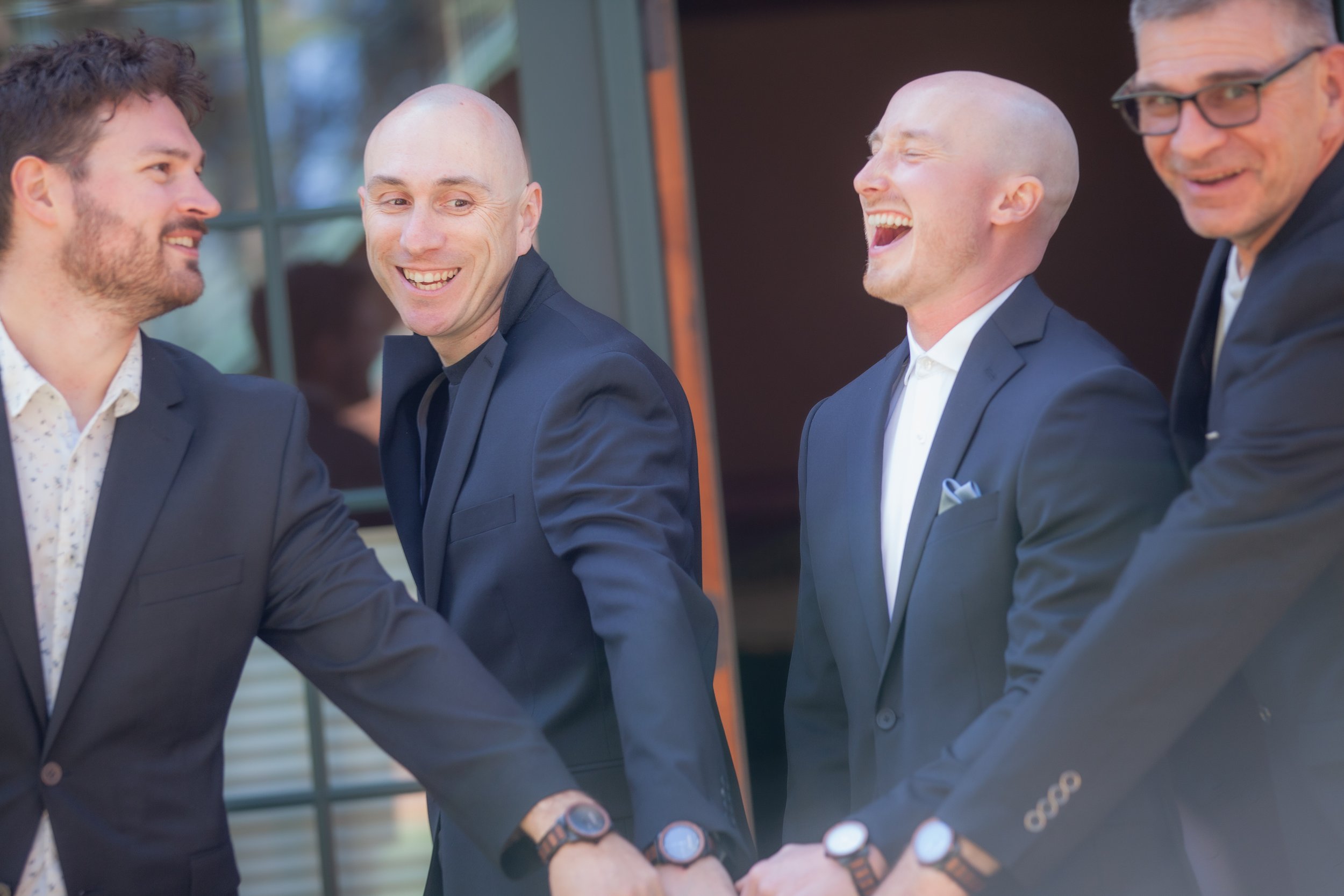 Groom laughing with groomsmen before the wedding. Sisters Oregon. 