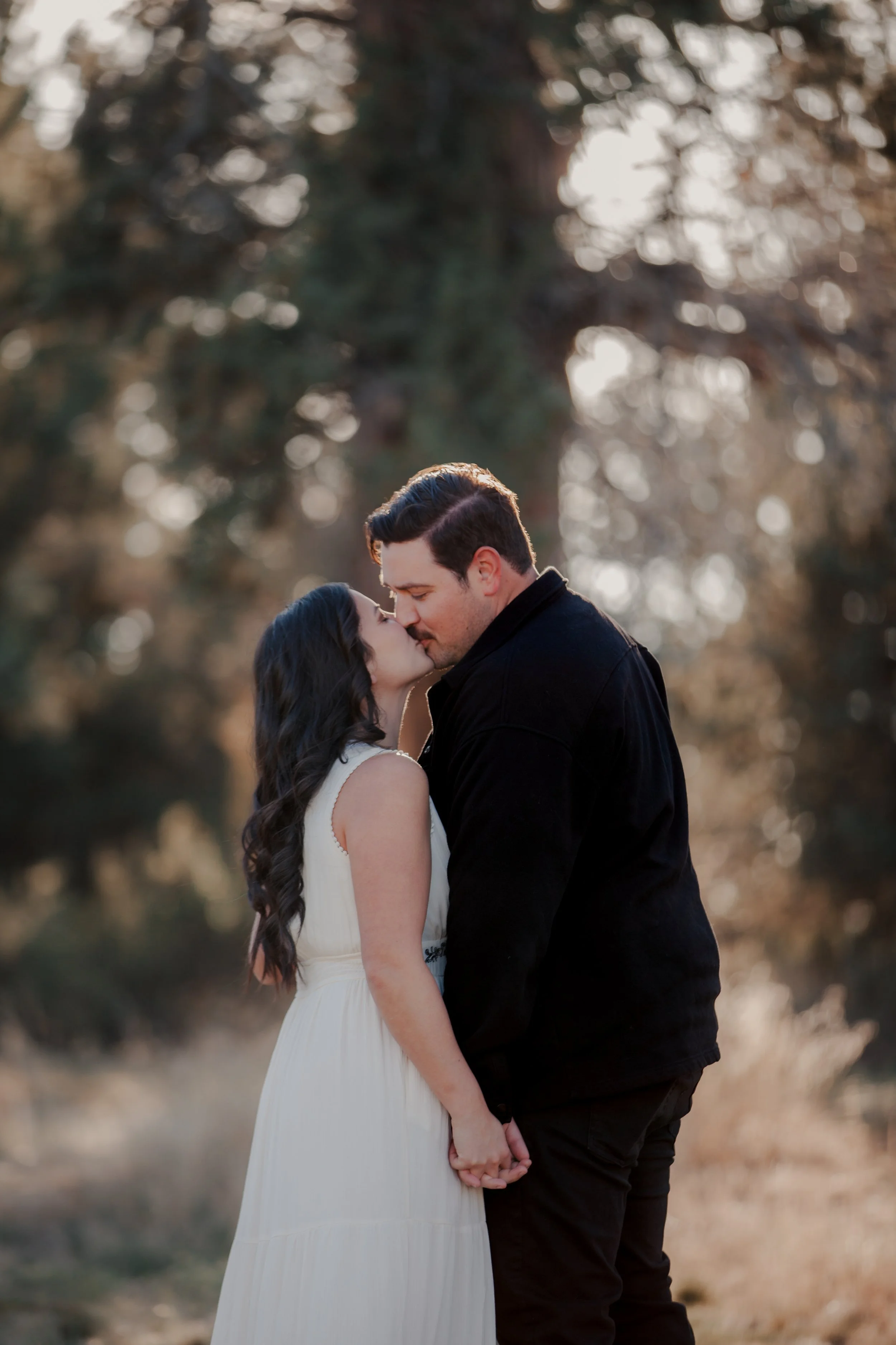 Engaged couple sharing a quiet moment at their private ranch in Bend, Oregon during a spring engagement session.
