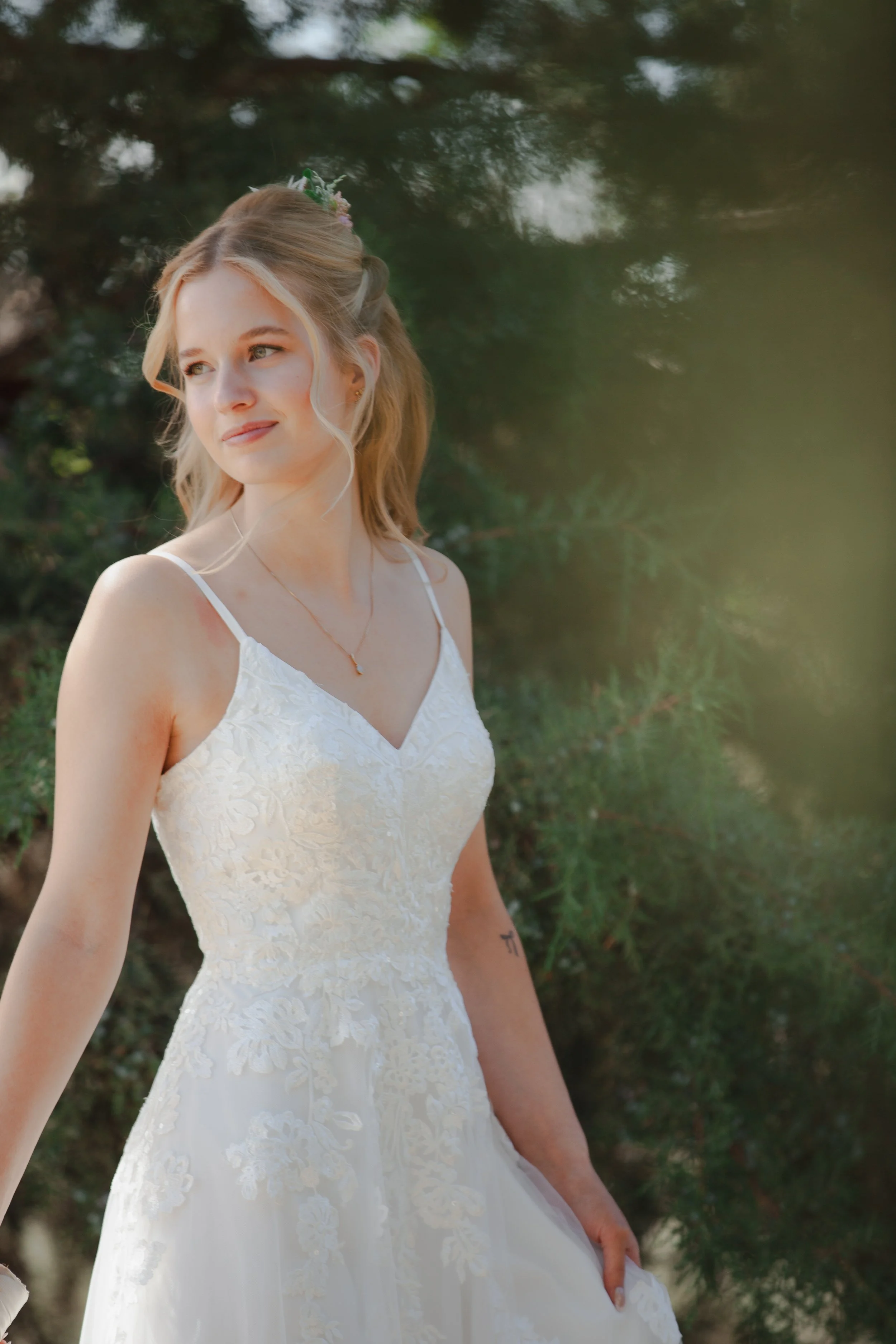 Bride glowing in afternoon light during an outdoor bridal portrait at Hanai Foundation in Bend