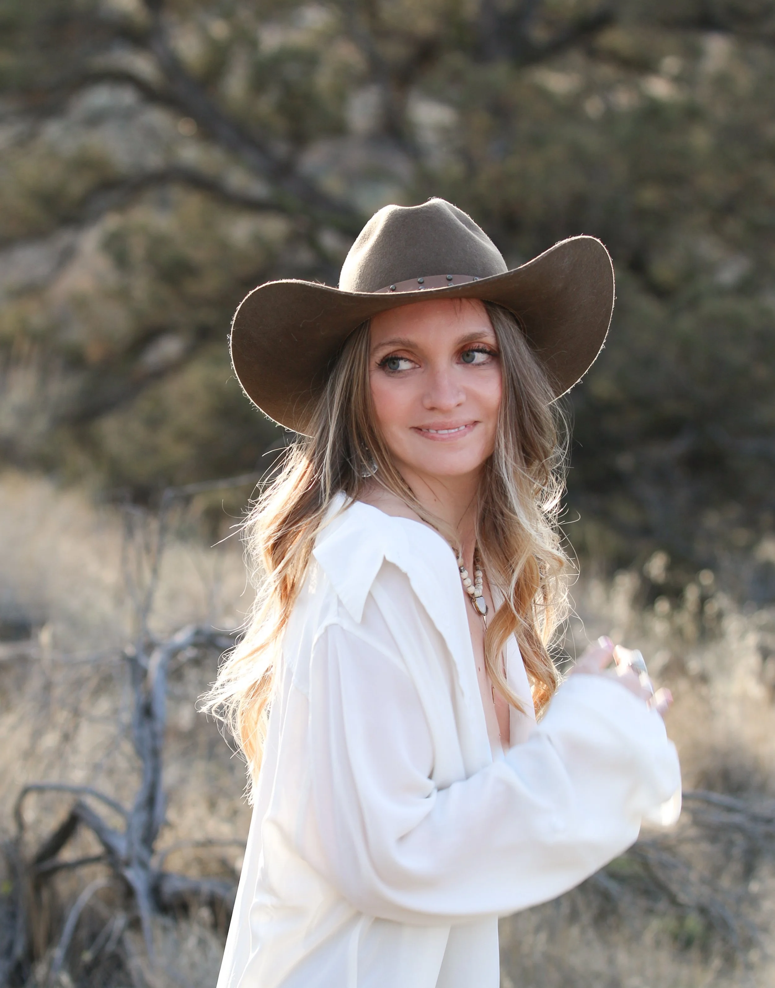 Portrait of Dominique Noël outdoors in Central Oregon reflecting the warmth, authenticity, and approachable experience behind Dominique Noël Photography.