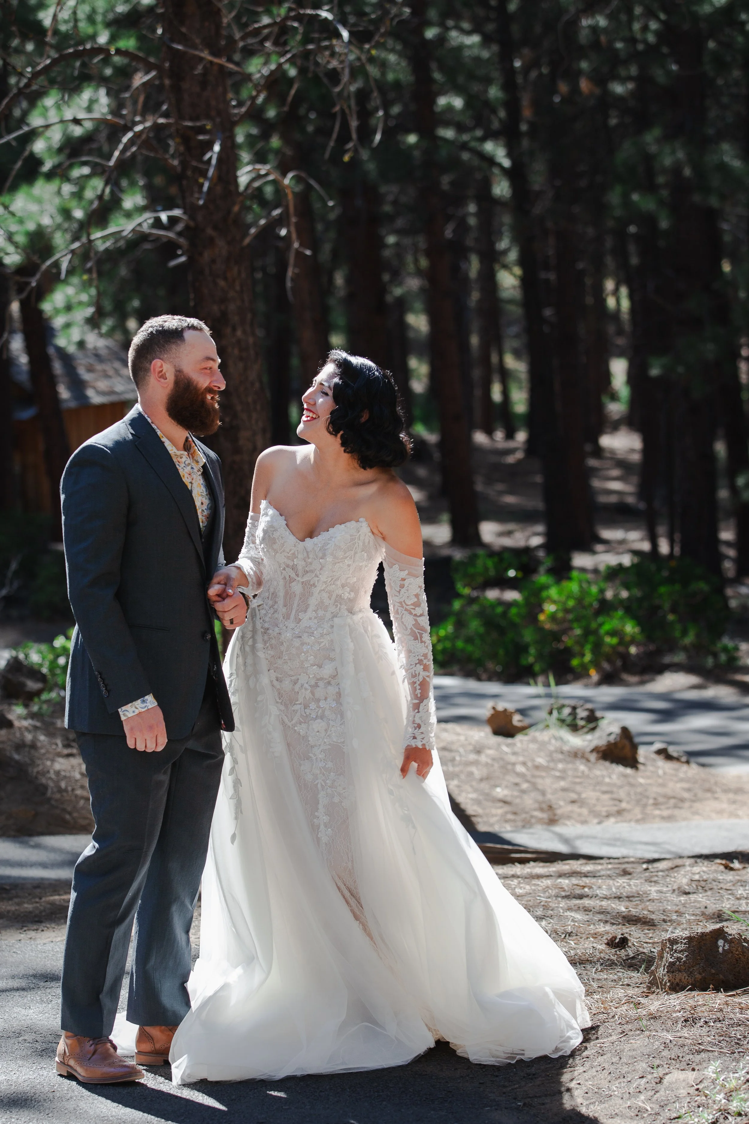 Bride and groom walking through the High Desert Museum grounds during their wedding near Bend, Oregon