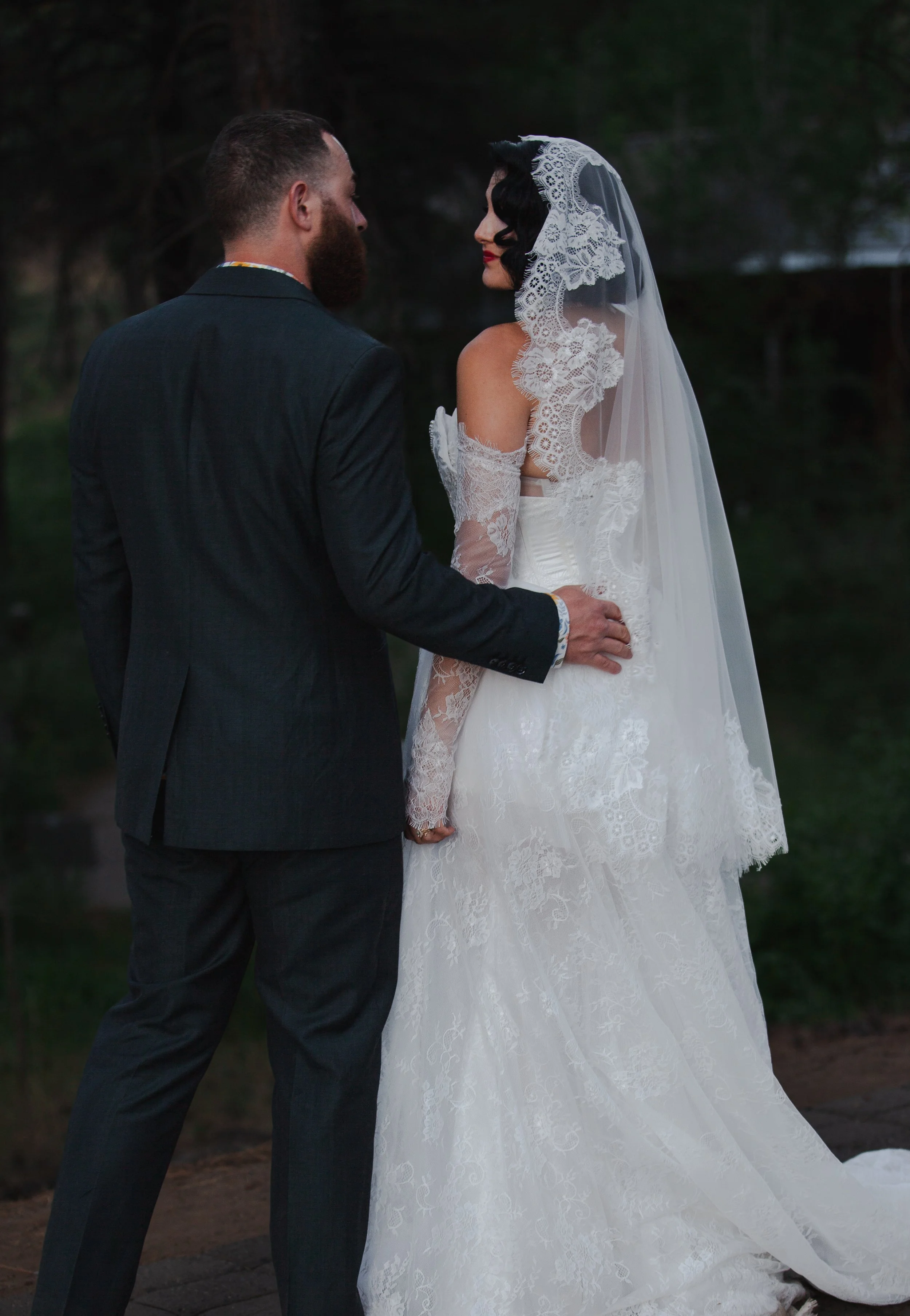 Bride and groom embracing during an intimate wedding portrait.