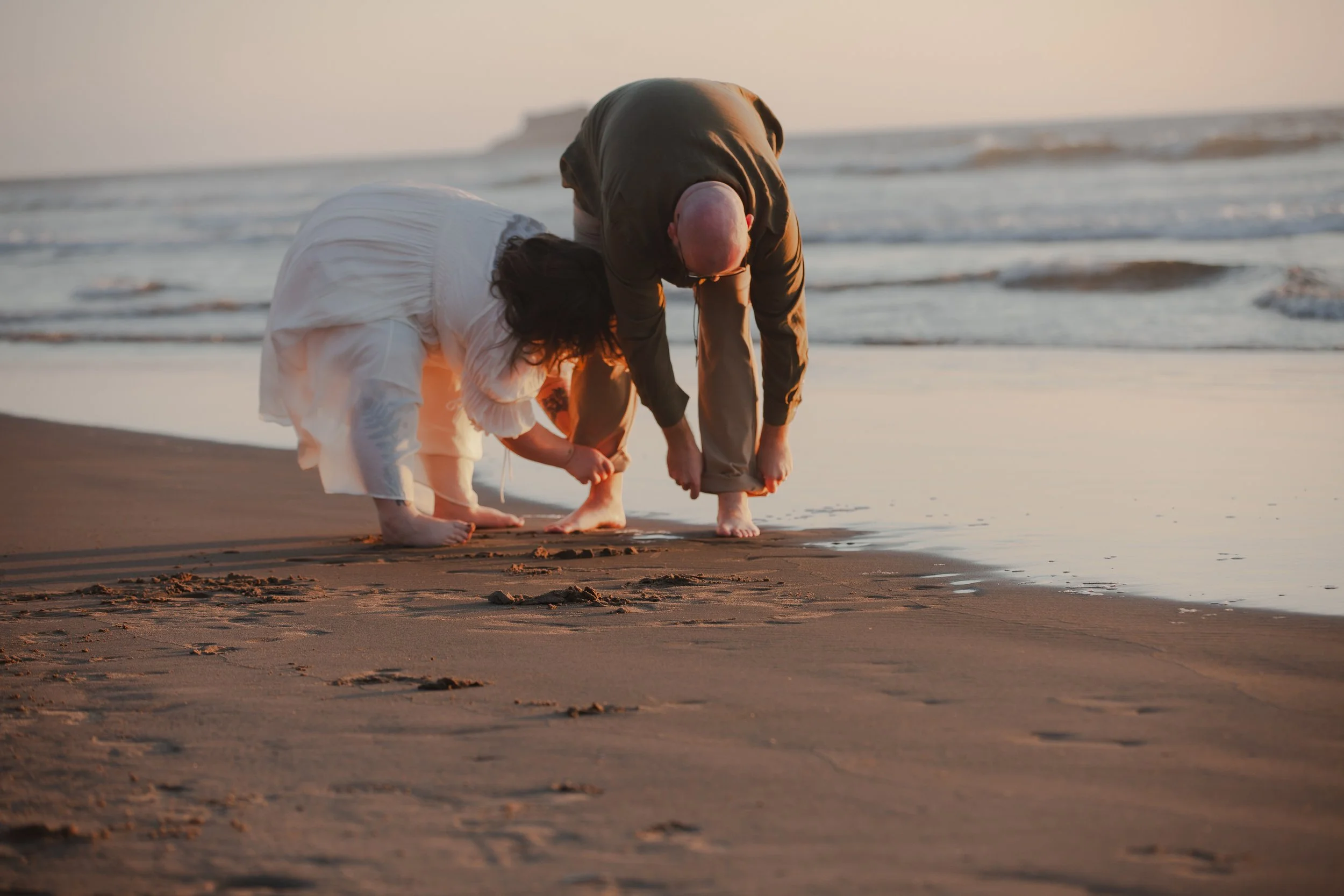 1. Windswept engagement portrait in Manzanita Oregon with Pacific Ocean backdrop
