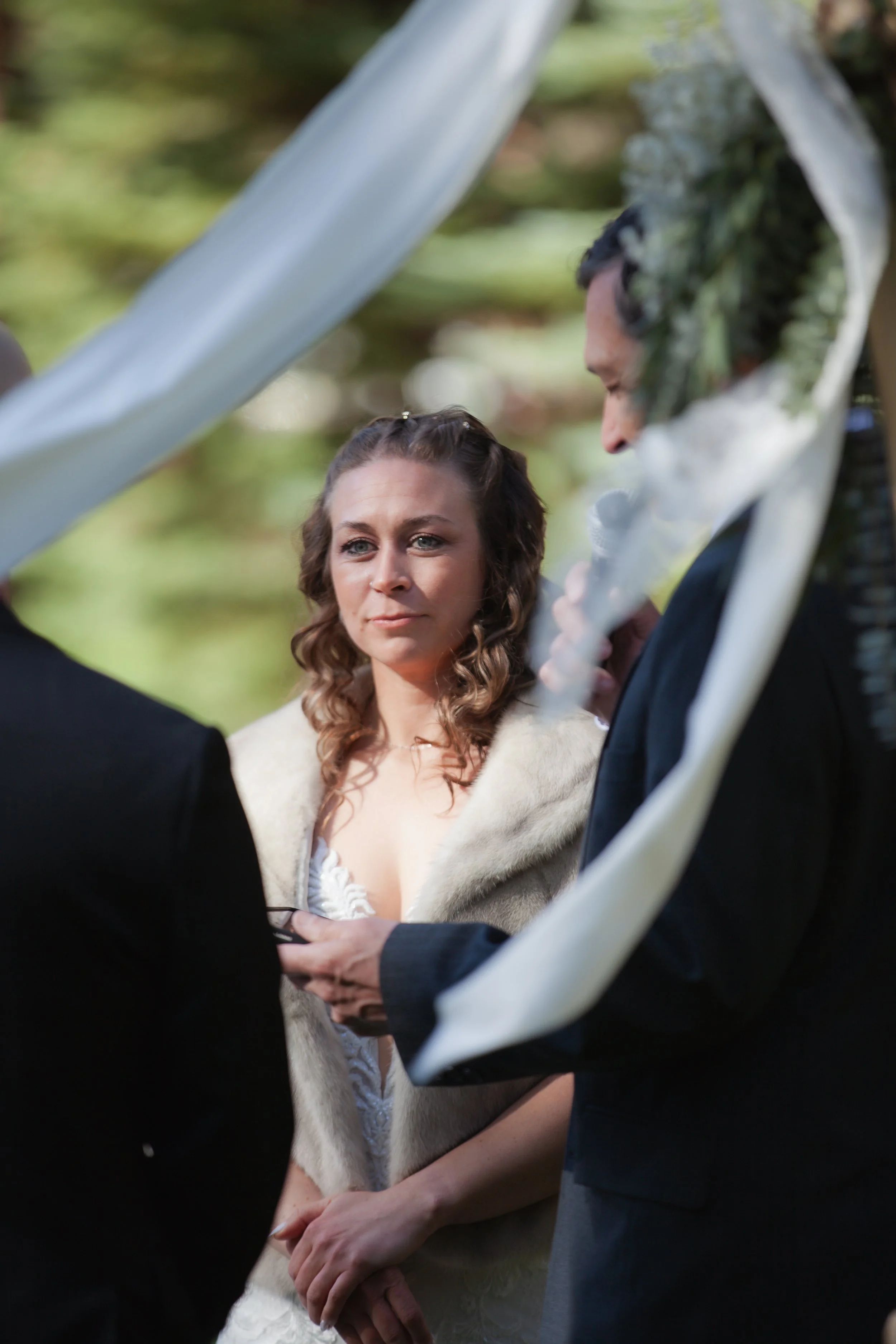 Outdoor wedding ceremony beneath towering pine trees in Central Oregon. Five Pines Lodge. Sisters Oregon. 