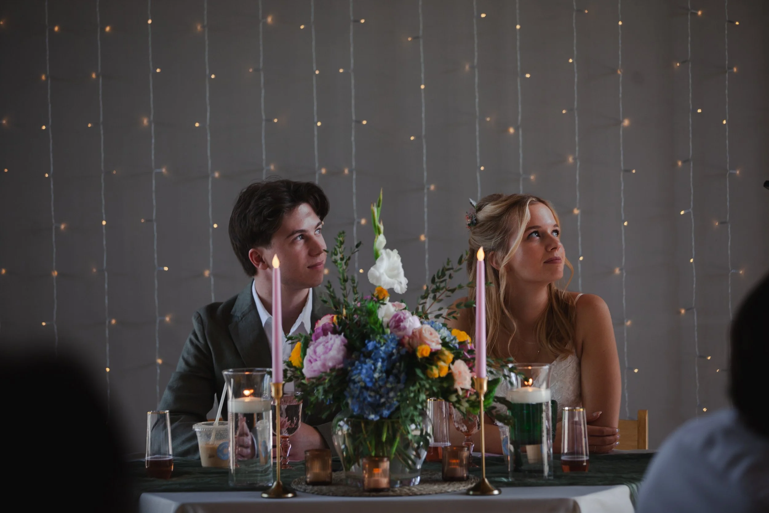 Bride and groom seated together at their intimate brunch wedding reception in Bend, Oregon