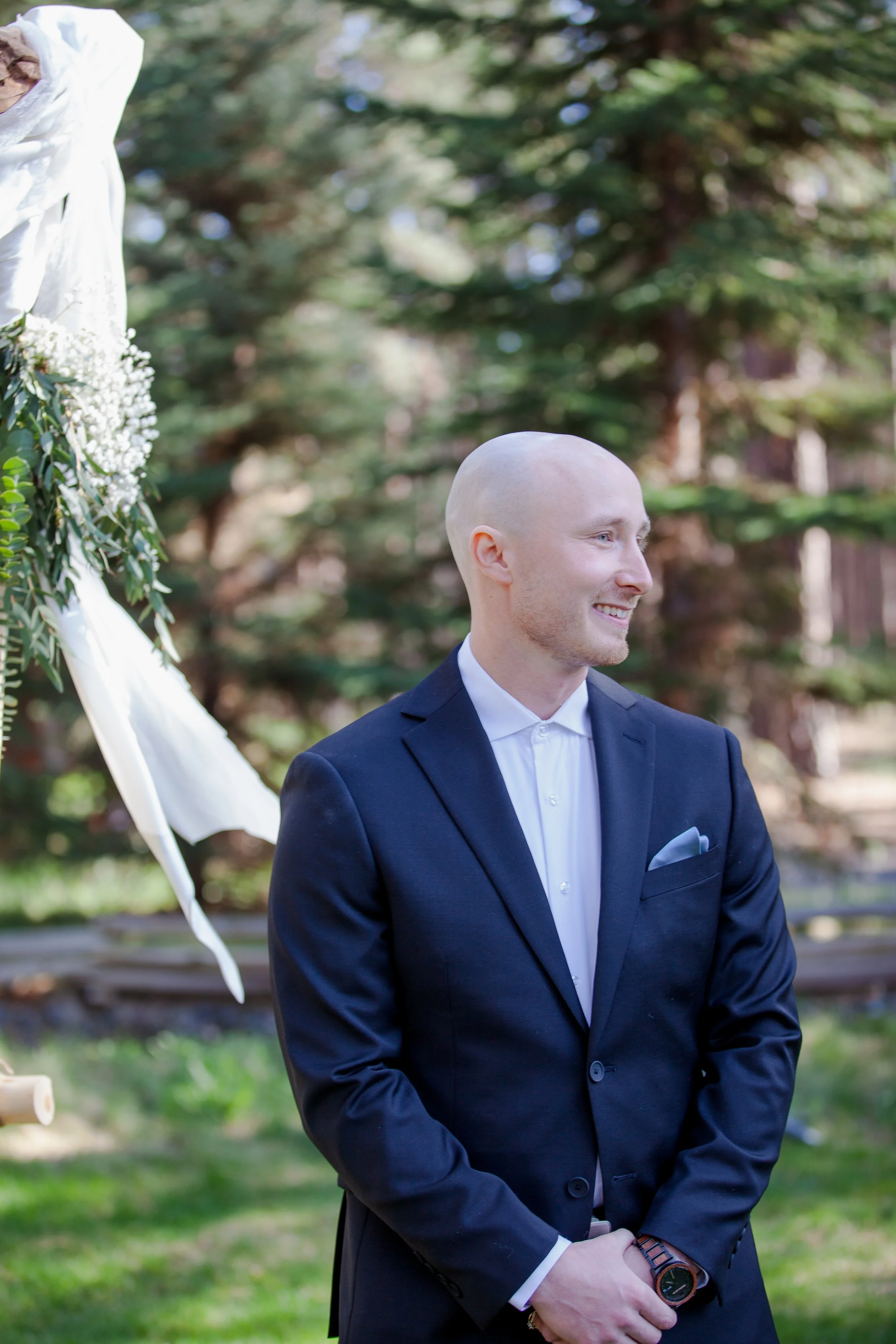 Outdoor wedding ceremony beneath towering pine trees in Central Oregon. Five Pines Lodge. Sisters Oregon. 