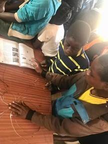 Students use wire to create replica of the parts of a spider.