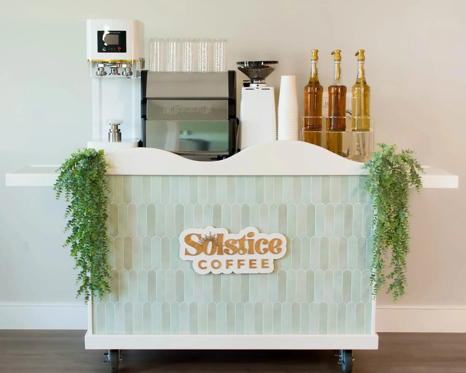 Green mobile coffee cart that is available for public and private events in Austin, texas.