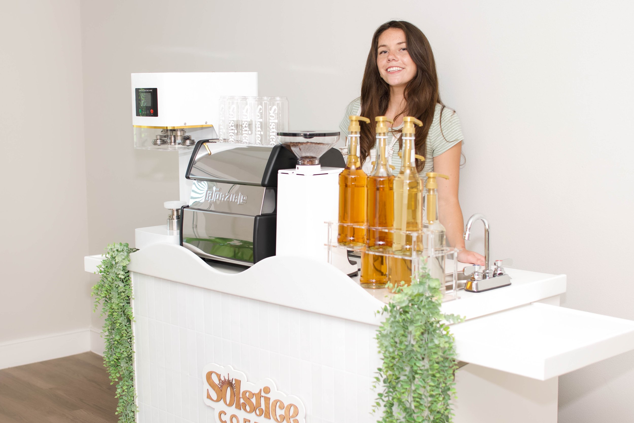 A white coffee cart used for private and public events in Austin texas.