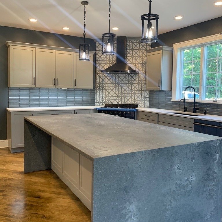 Clean lines. Bold texture. Perfect execution.

This kitchen came together with a stunning waterfall island and a statement backsplash that brings the whole space to life. 

Every detail &mdash; from layout to leveling &mdash; was built for precision 